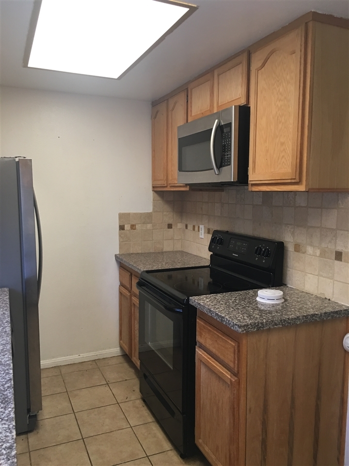 2522 Wanek Road, Unit C Escondido, CA 92027 - Photo 4 of 6 Stove and microwave convey