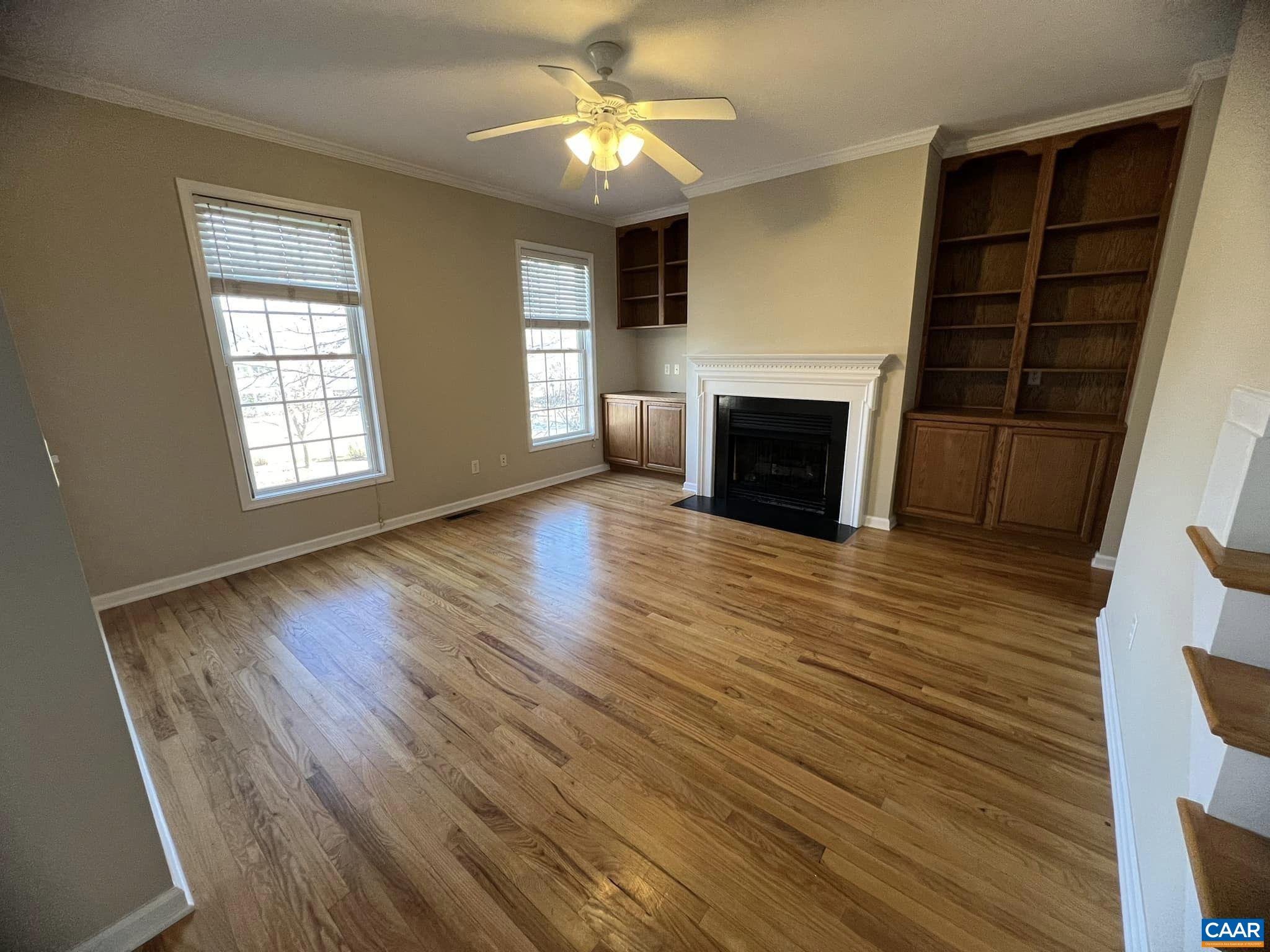 131 Burnet Street Charlottesville, VA 22902 - Photo 11 of 26 wooden floor fireplace and windows in an empty room