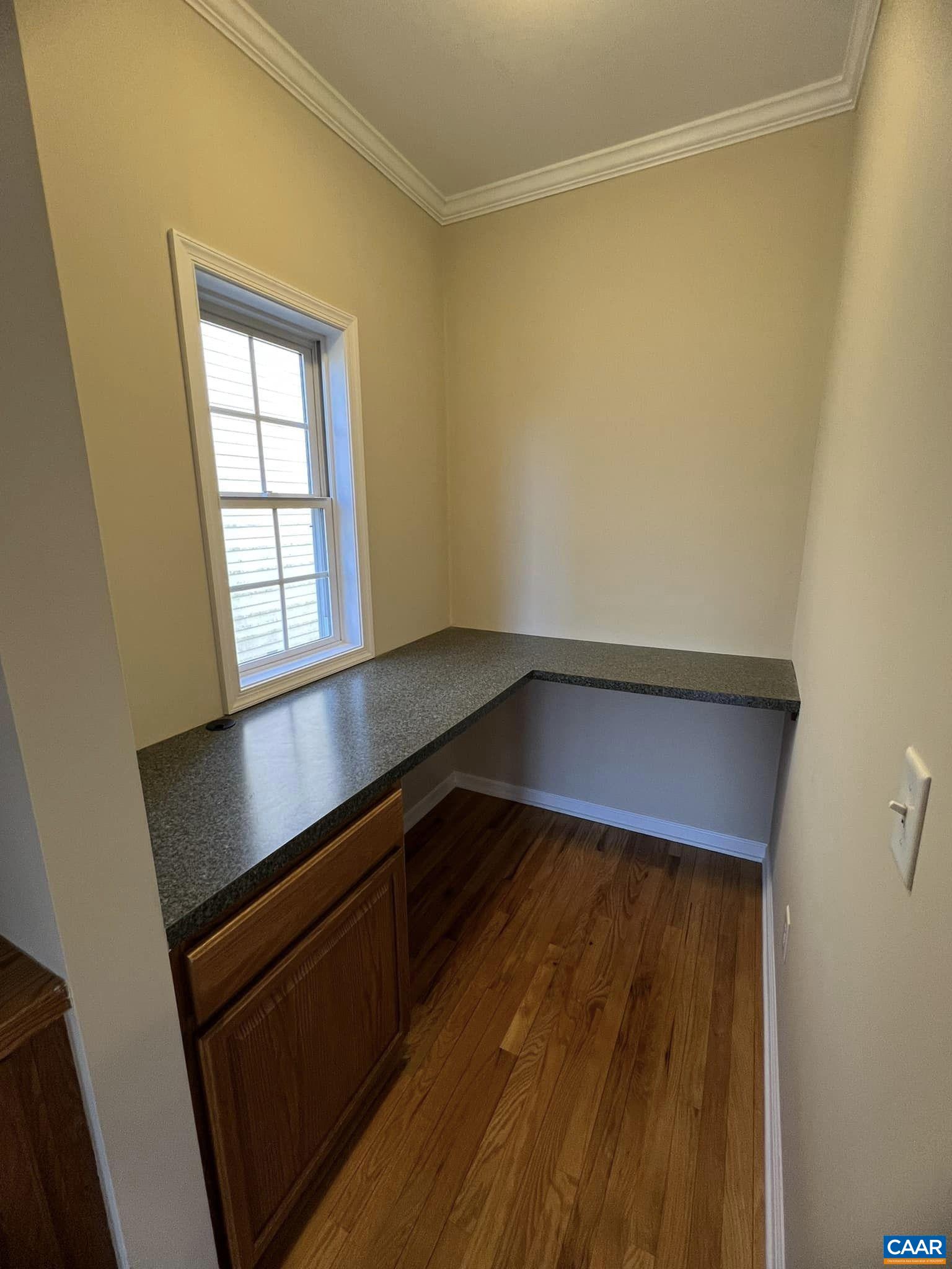 131 Burnet Street Charlottesville, VA 22902 - Photo 12 of 26 an empty room with wooden floor and windows