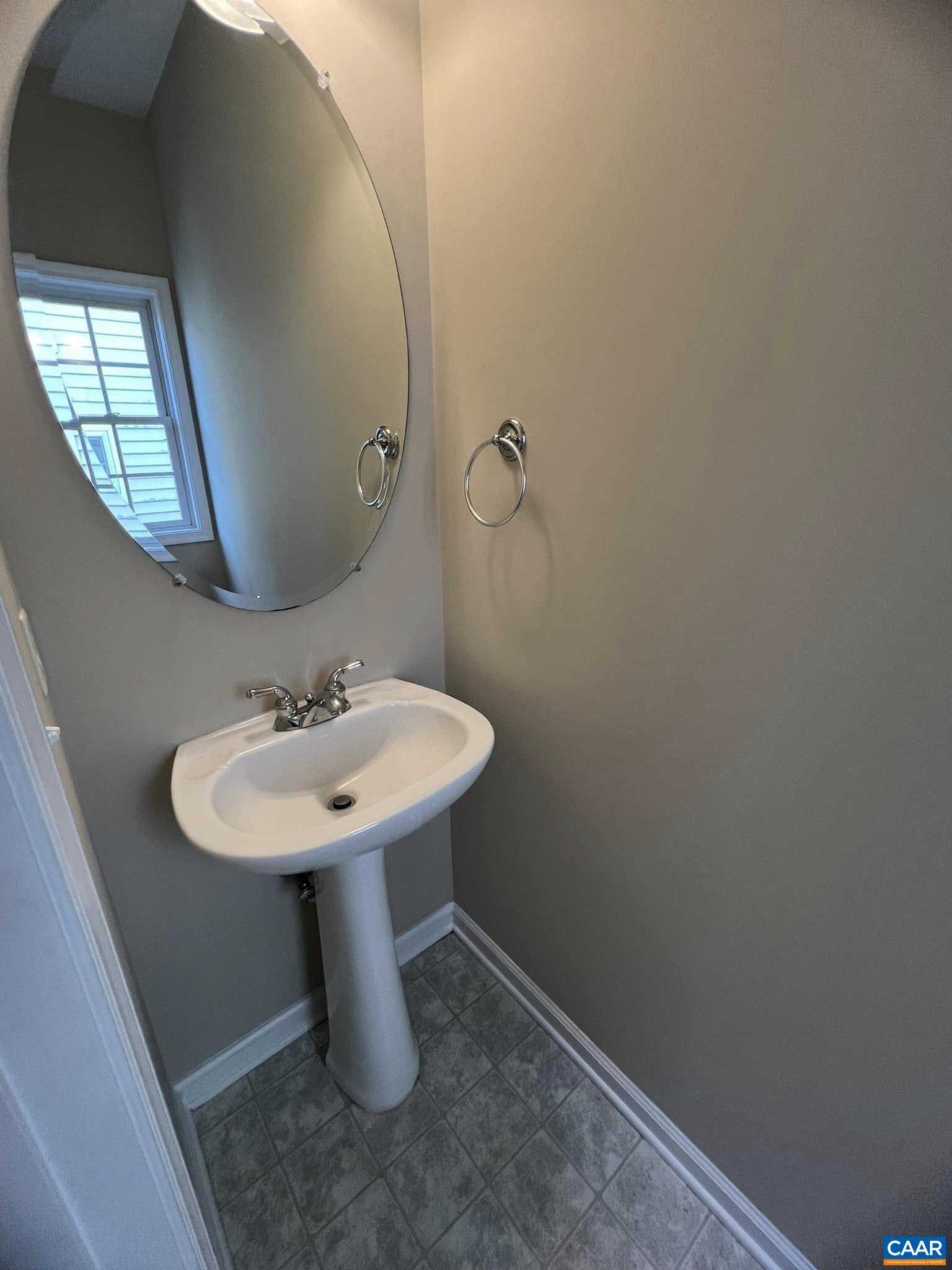 131 Burnet Street Charlottesville, VA 22902 - Photo 13 of 26 a bathroom with a sink a mirror and a toilet