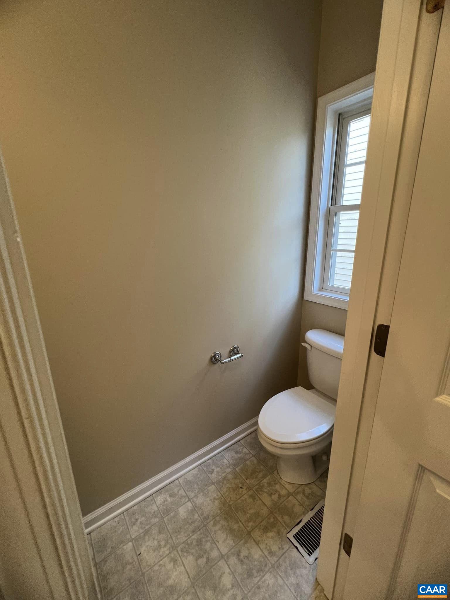 131 Burnet Street Charlottesville, VA 22902 - Photo 14 of 26 a bathroom with a granite countertop toilet and a sink