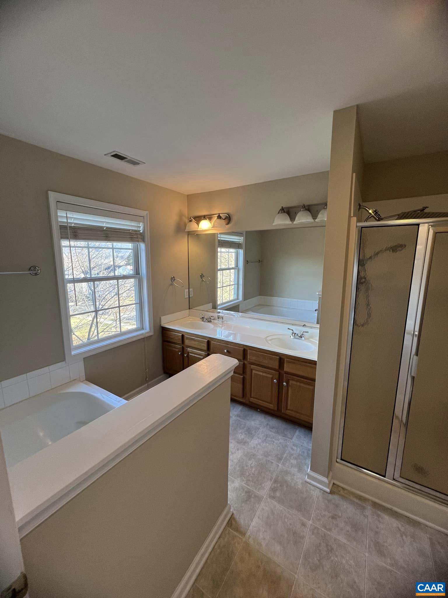 131 Burnet Street Charlottesville, VA 22902 - Photo 20 of 26 a large white kitchen with a sink a refrigerator and dishwasher