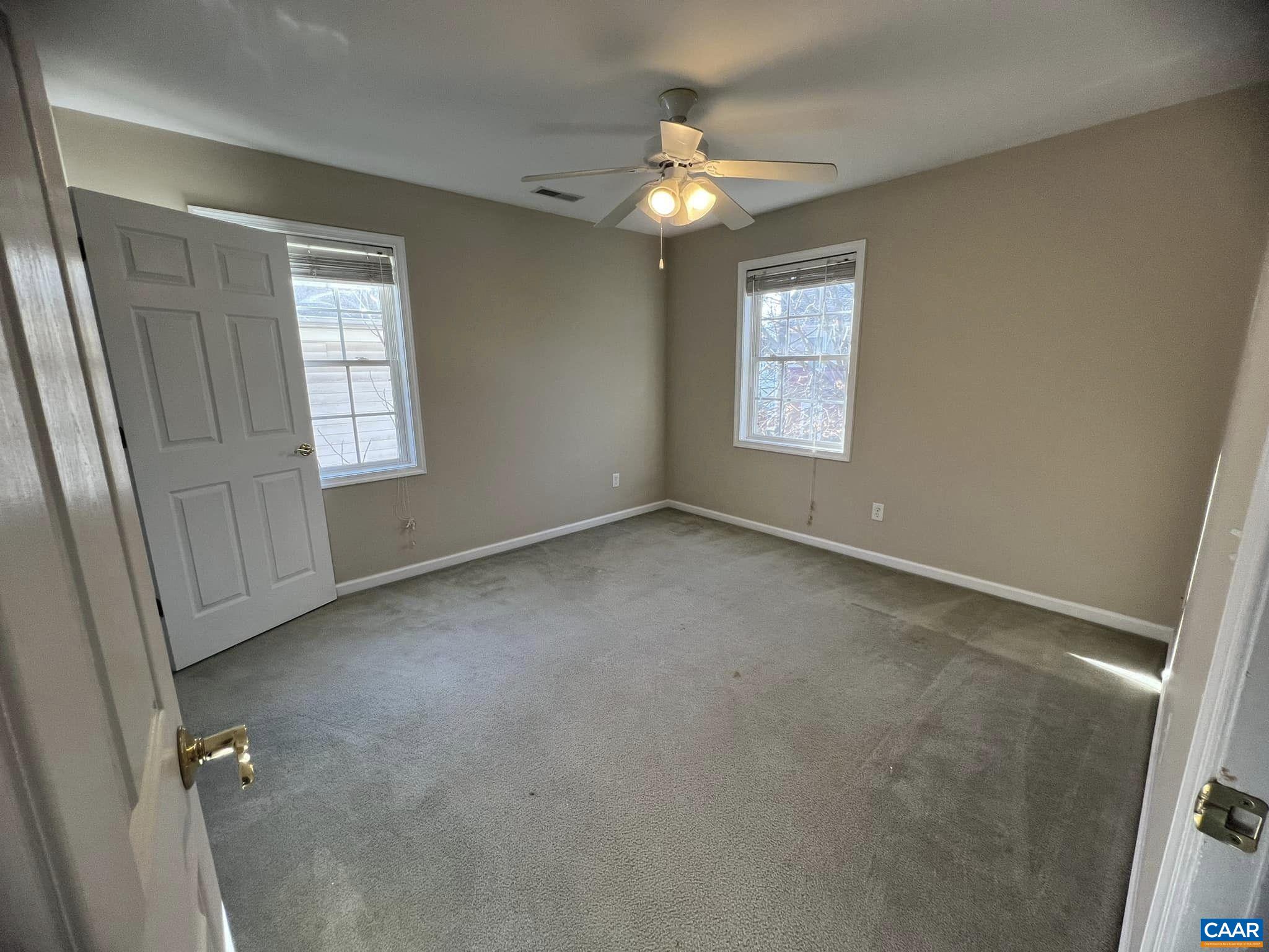 131 Burnet Street Charlottesville, VA 22902 - Photo 25 of 26 an empty room with windows and chandelier fan