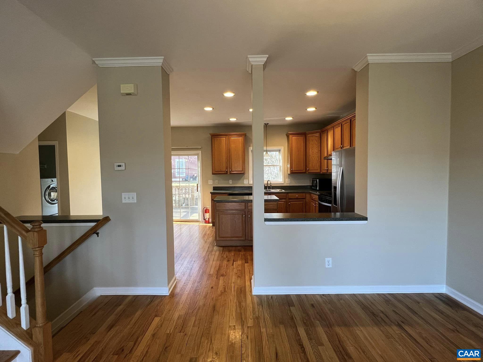 131 Burnet Street Charlottesville, VA 22902 - Photo 7 of 26 a view of kitchen with kitchen island wooden floor center island and stainless steel appliances