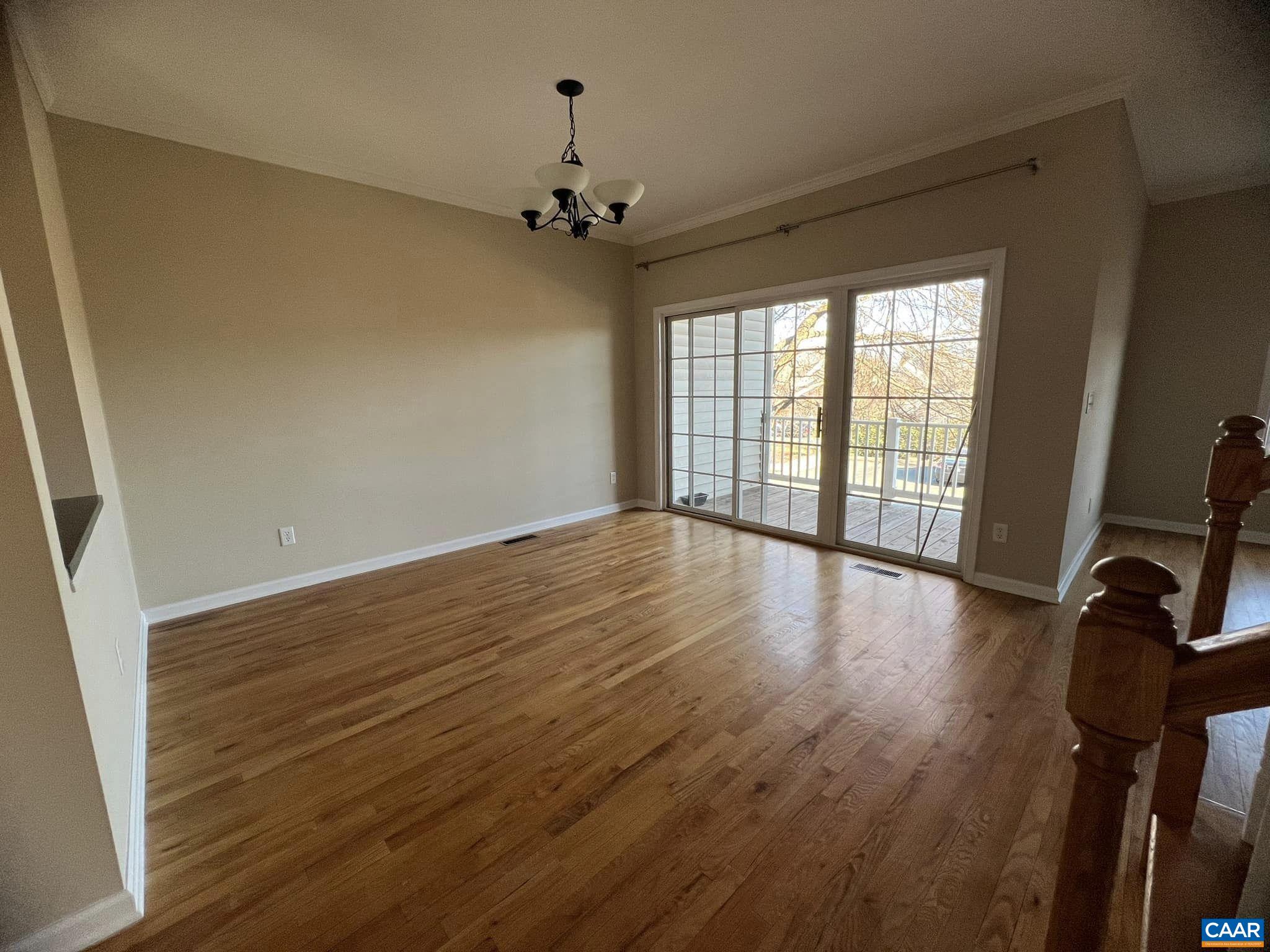 131 Burnet Street Charlottesville, VA 22902 - Photo 10 of 26 a view of an empty room with wooden floor and a window
