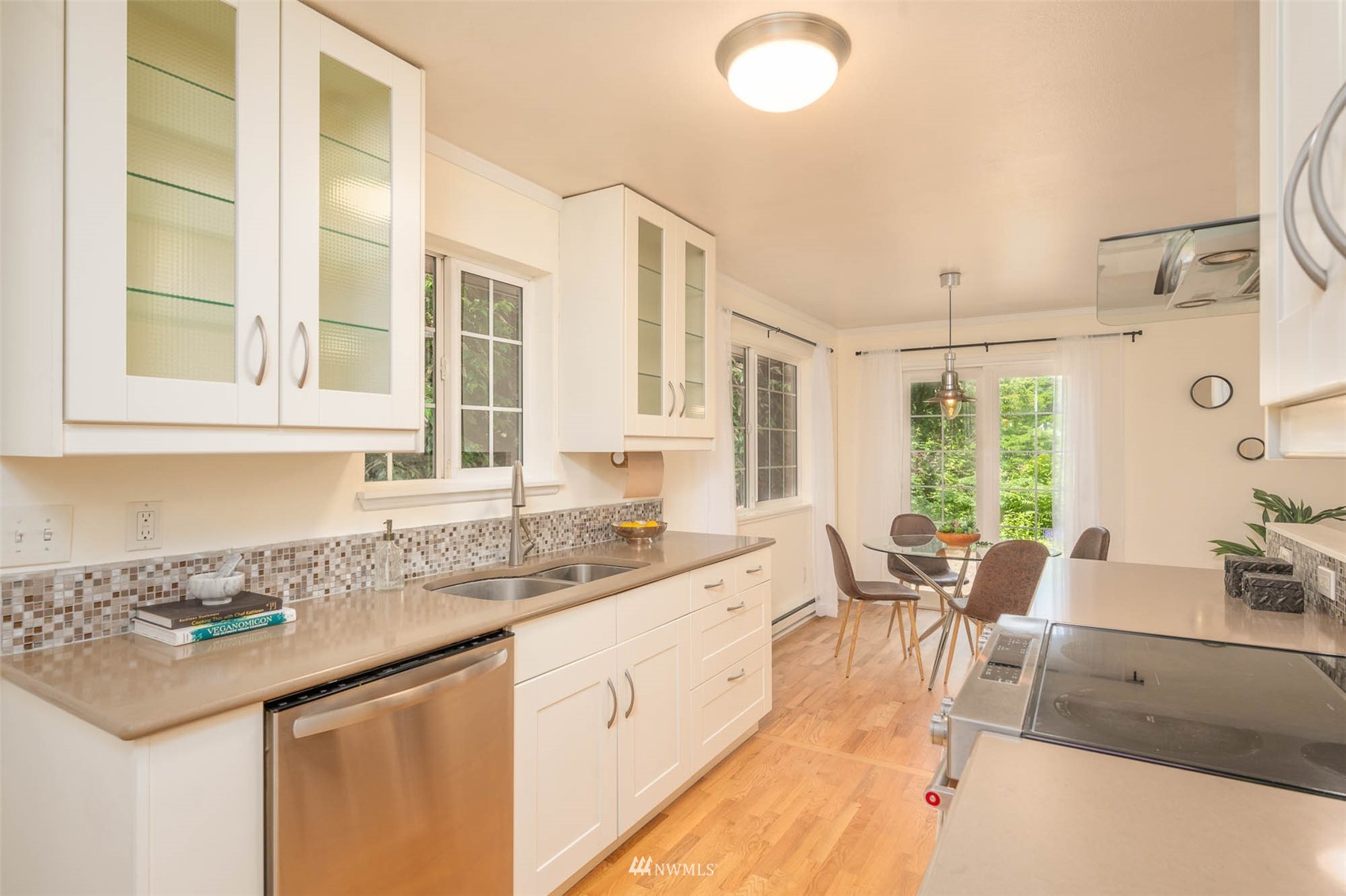 9705 Southwest Cemetery Road Vashon, WA 98070 - Photo 13 of 32 a large white kitchen with a large window
