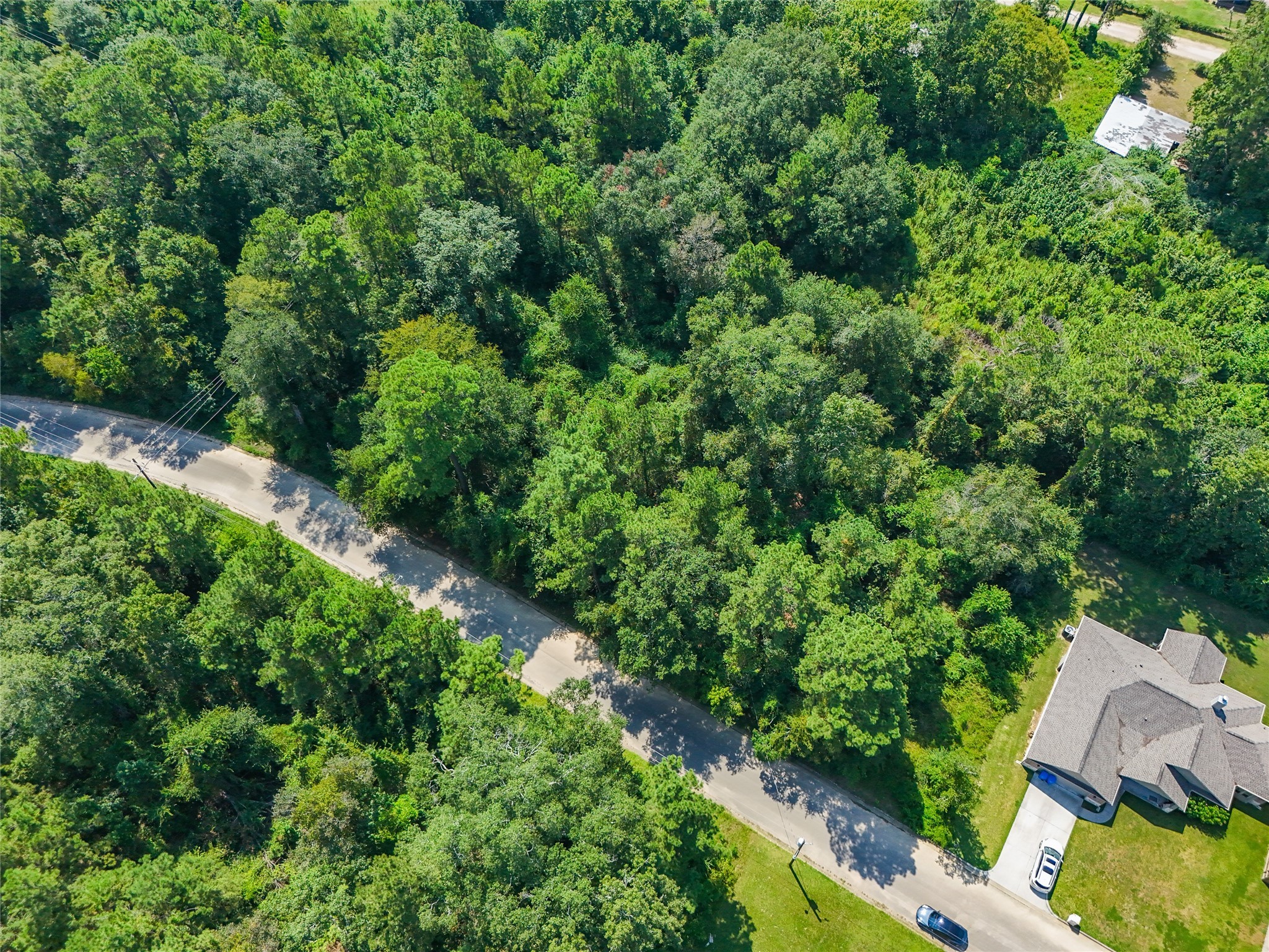 Tbd Tbd Lane Splendora, TX 77372 - Photo 9 of 10 an aerial view of residential house with outdoor space and trees all around