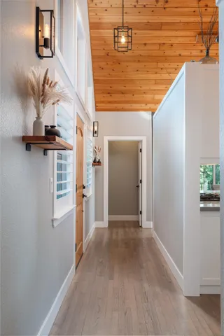 a view of a livingroom with wooden floor and staircase