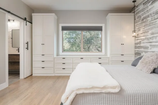 a large white bed in a white room