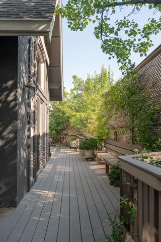 a view of balcony with wooden floor and outdoor space