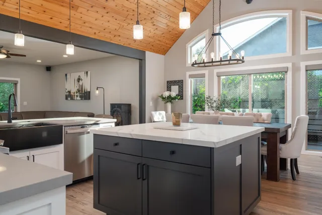 a kitchen with a sink and a stove
