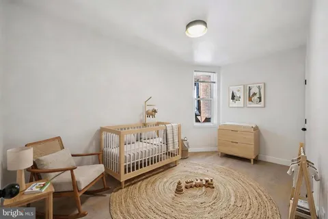 a bedroom with a bed and a couch