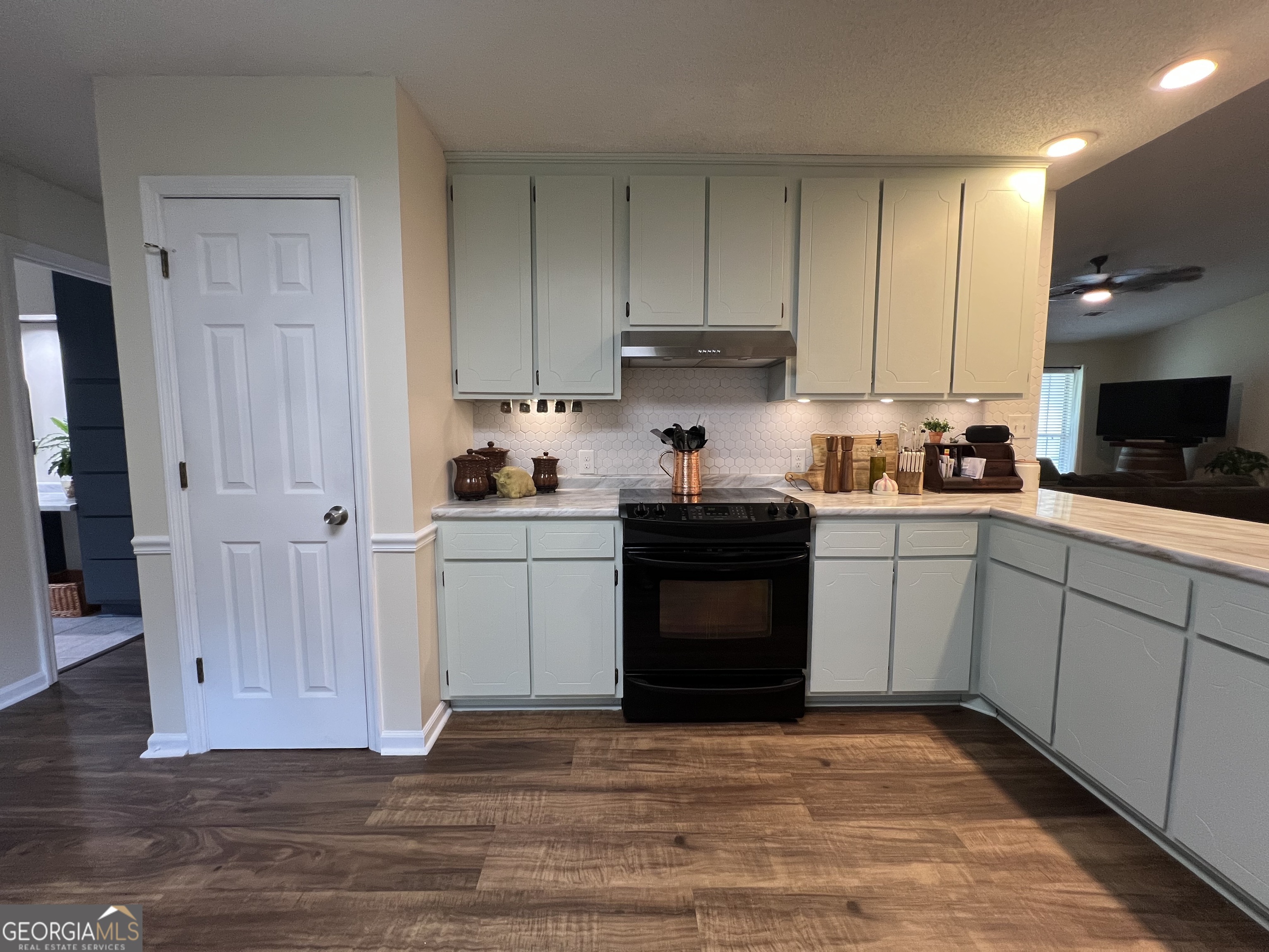 113 Camelot Drive Dublin, GA 31021 - Photo 17 of 45 a kitchen with sink cabinets and stainless steel appliances