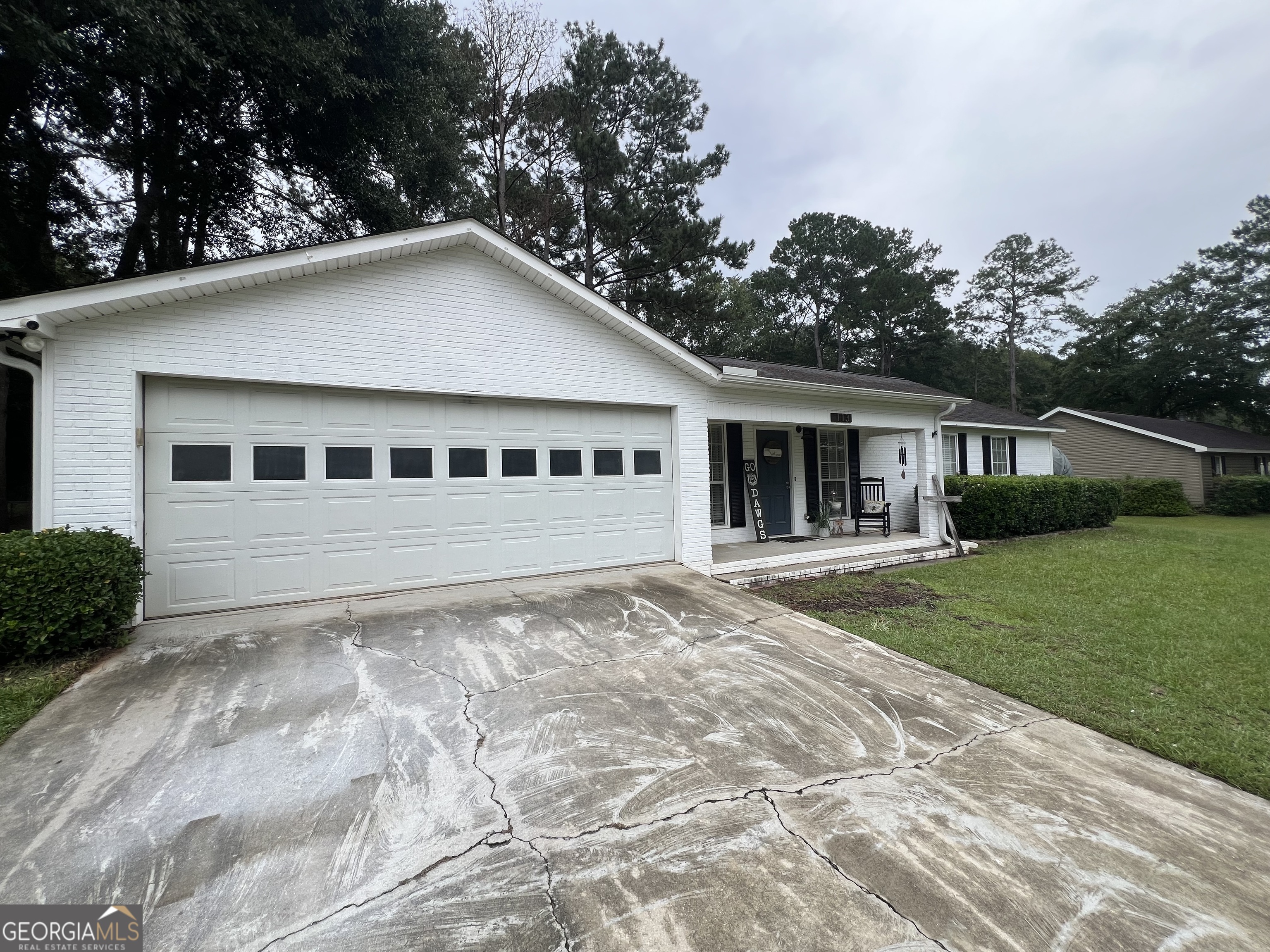 113 Camelot Drive Dublin, GA 31021 - Photo 2 of 45 a house with trees in the background
