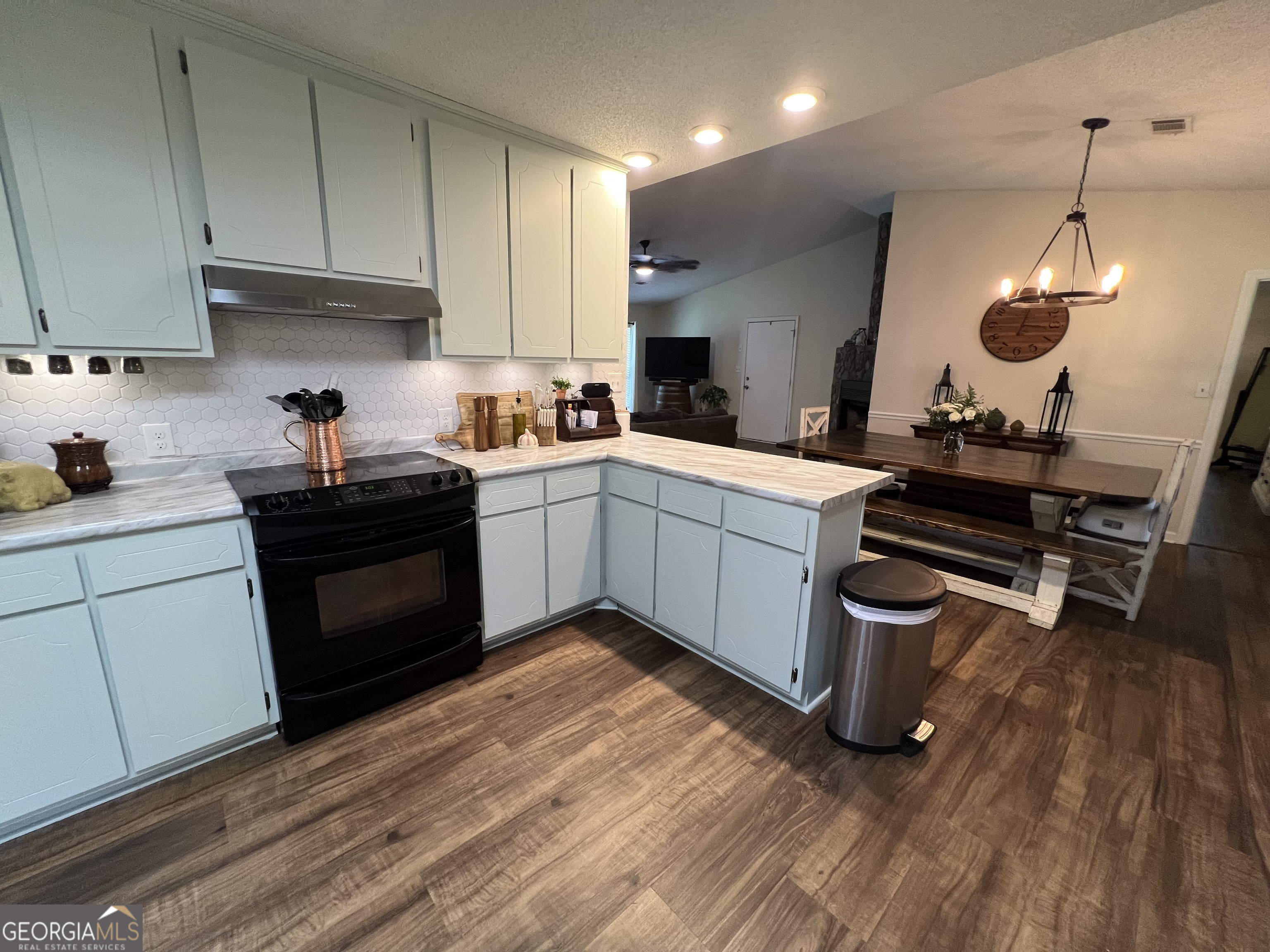 113 Camelot Drive Dublin, GA 31021 - Photo 24 of 45 a kitchen with a sink stove and cabinets