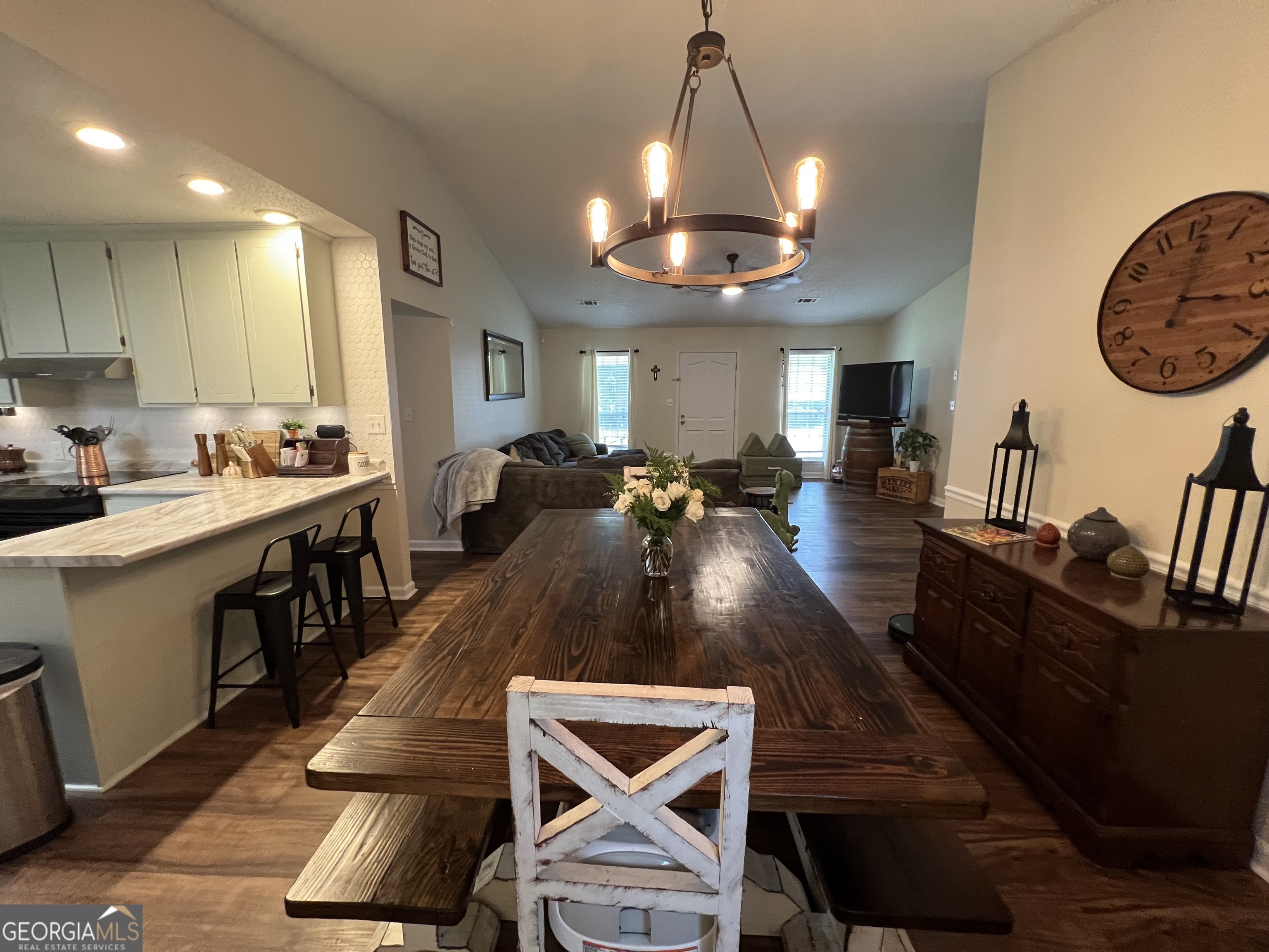 113 Camelot Drive Dublin, GA 31021 - Photo 25 of 45 a view of a dining room with furniture a chandelier and wooden floor