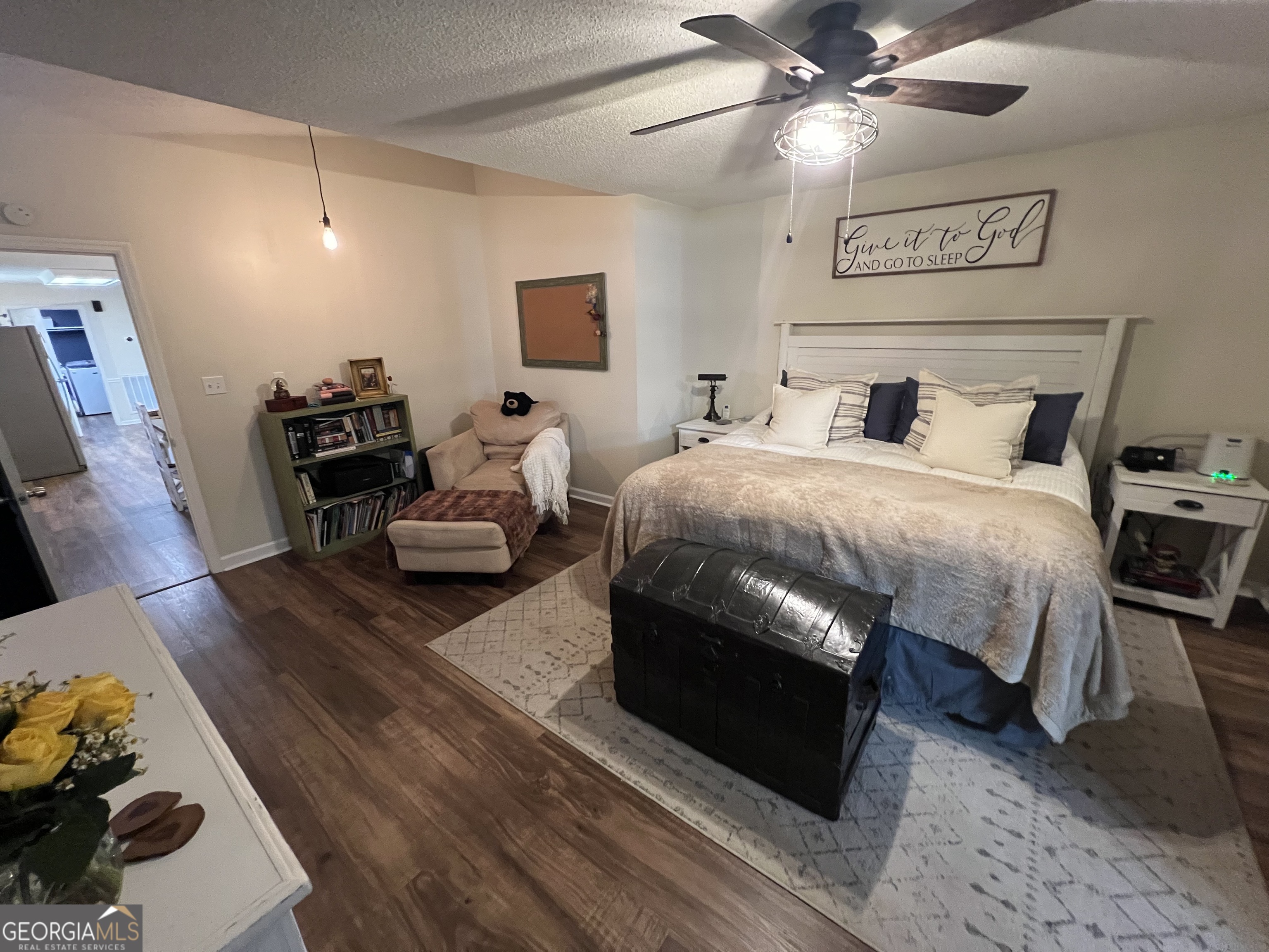 113 Camelot Drive Dublin, GA 31021 - Photo 31 of 45 a bedroom with a bed and a chandelier