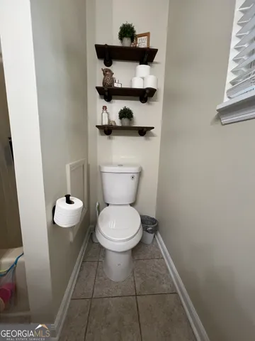 a bathroom with a toilet and a sink