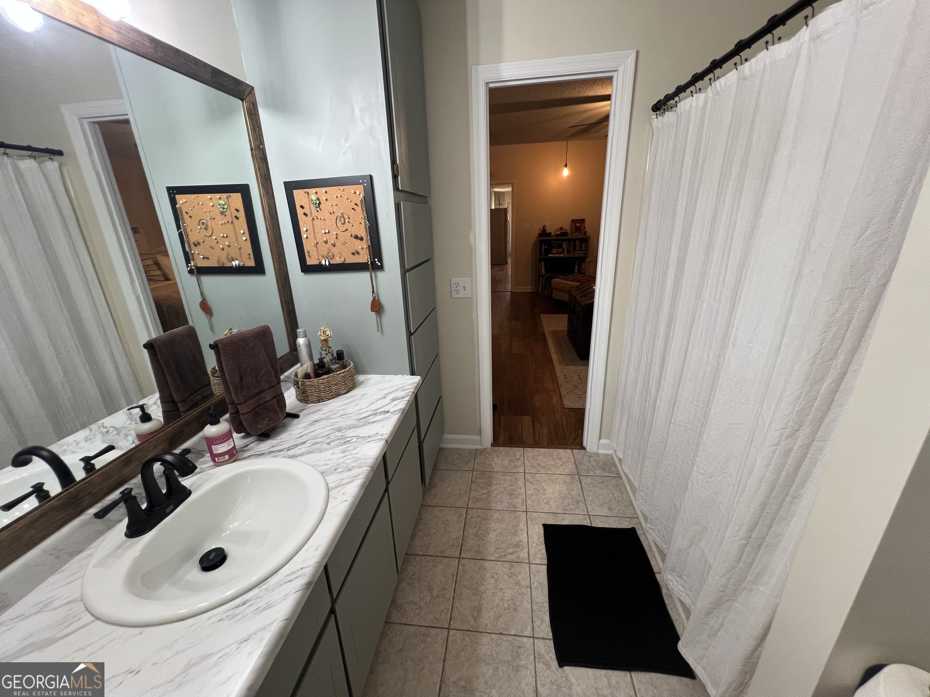 113 Camelot Drive Dublin, GA 31021 - Photo 34 of 45 a bathroom with a sink vanity and a mirror