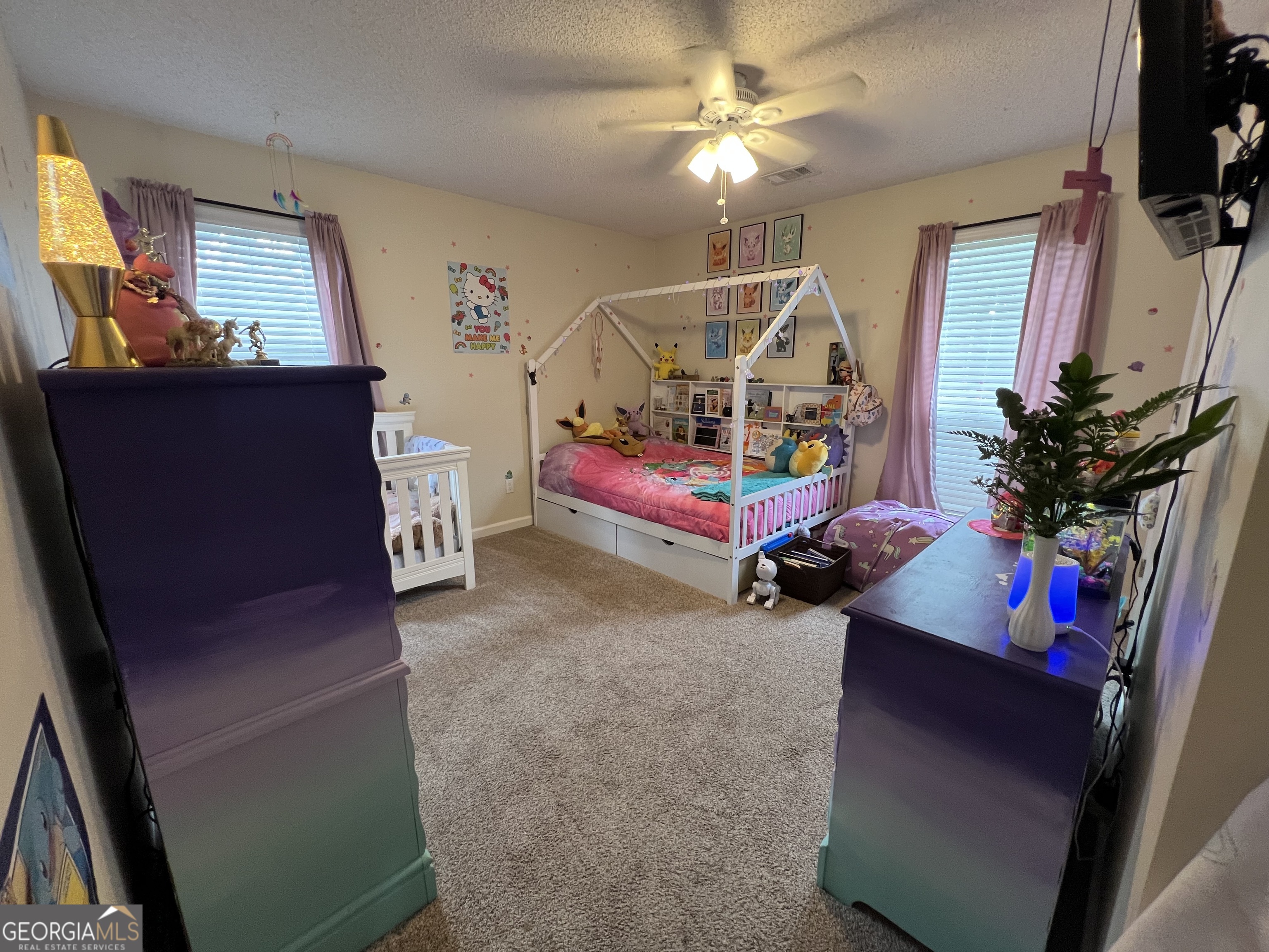 113 Camelot Drive Dublin, GA 31021 - Photo 38 of 45 a garage with furniture and a flat screen tv