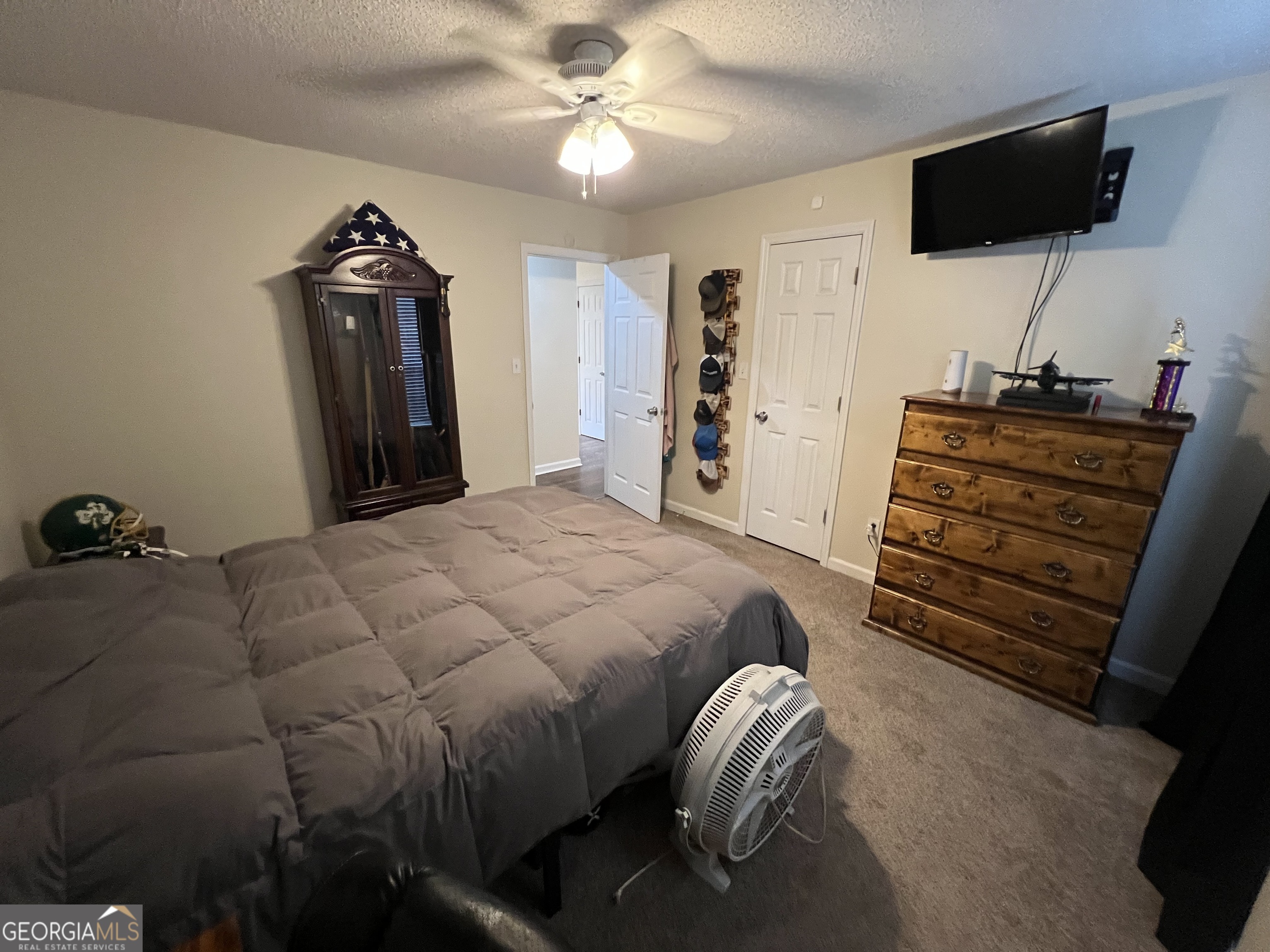 113 Camelot Drive Dublin, GA 31021 - Photo 41 of 45 a bedroom with a bed and a flat screen tv