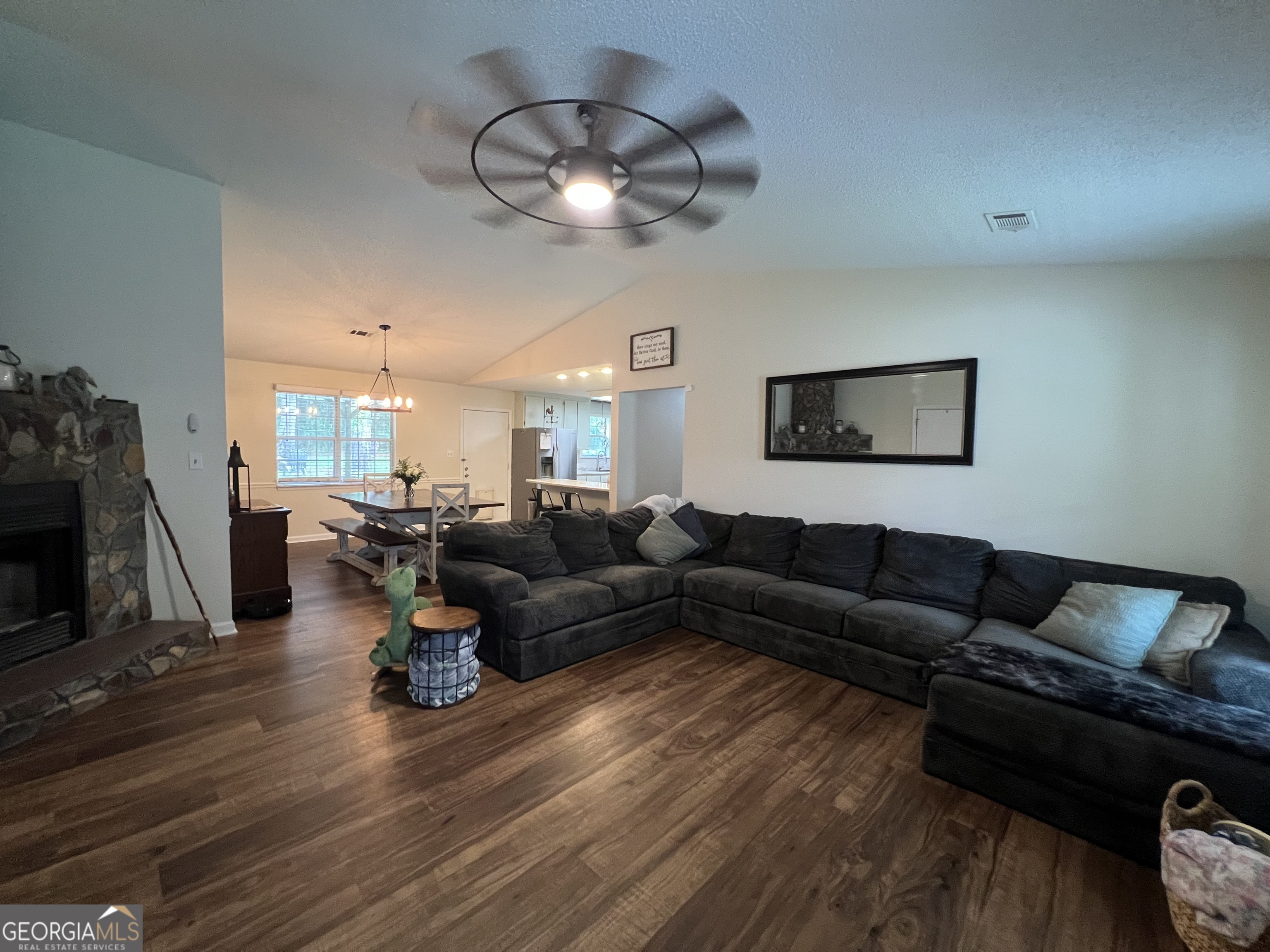 113 Camelot Drive Dublin, GA 31021 - Photo 10 of 45 a living room with furniture and a wooden floor