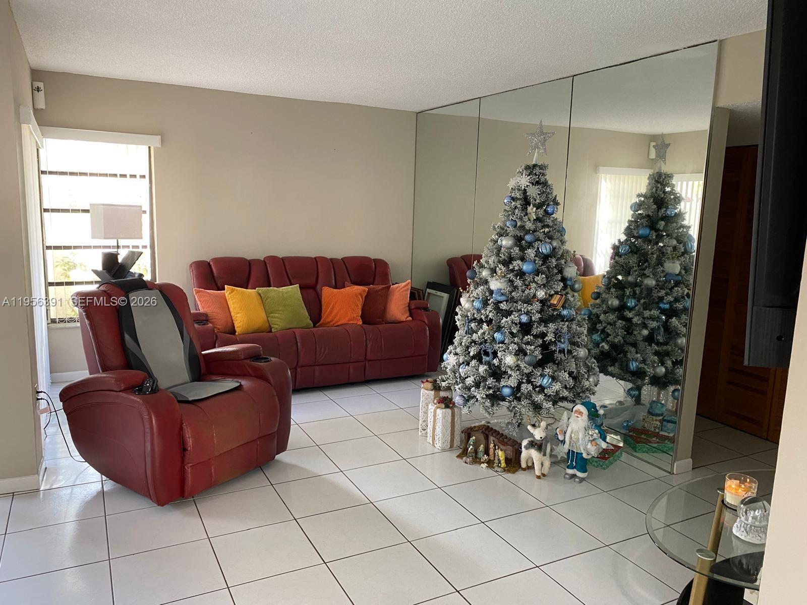 a living room with a couch and a window