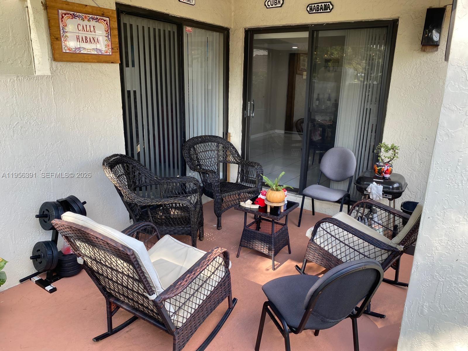 9070 Southwest 125th Avenue, Unit A101 Miami, FL 33186 - Photo 11 of 28 a living room with furniture and a window