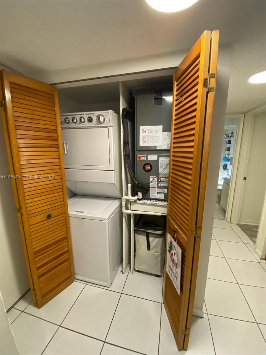 9070 Southwest 125th Avenue, Unit A101 Miami, FL 33186 - Photo 19 of 28 a kitchen with a stove and a refrigerator