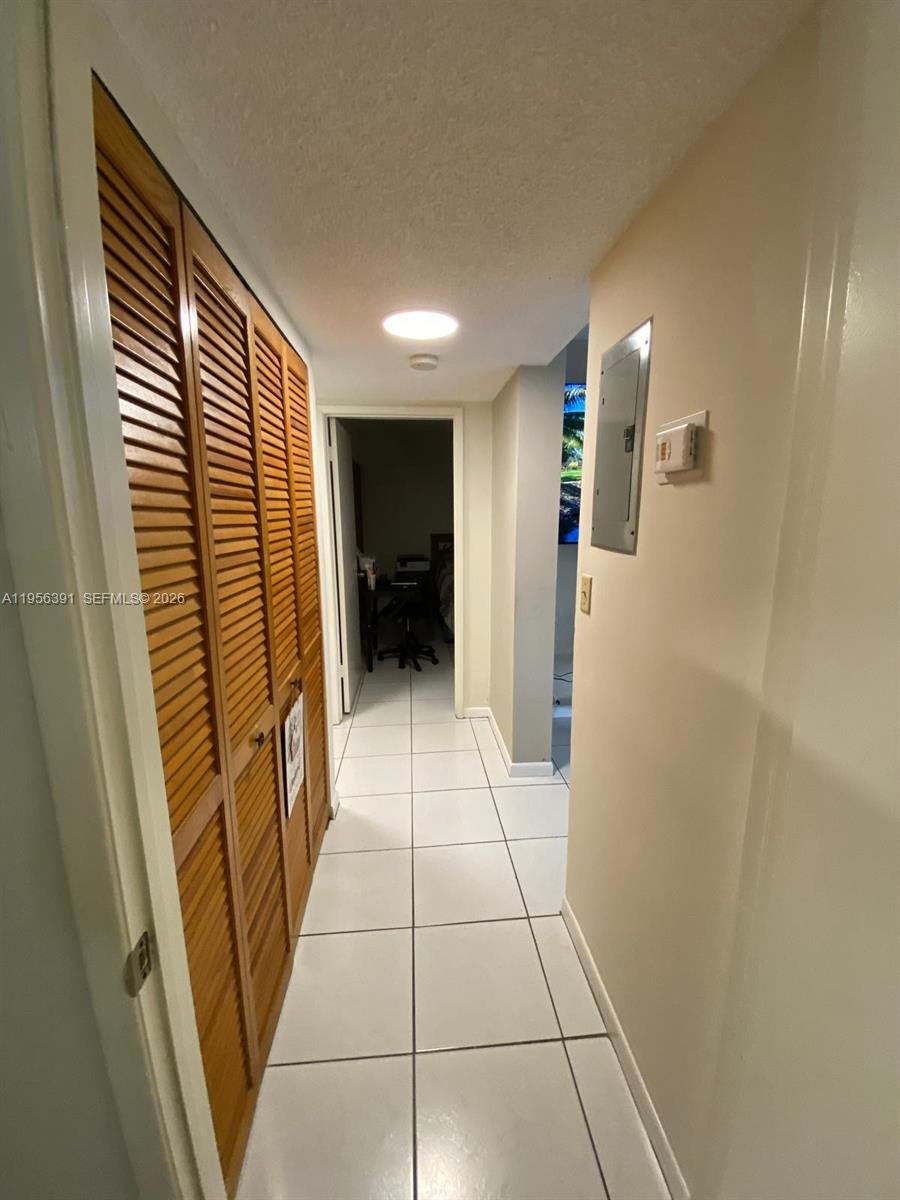 9070 Southwest 125th Avenue, Unit A101 Miami, FL 33186 - Photo 23 of 28 a view of hallway with a sink