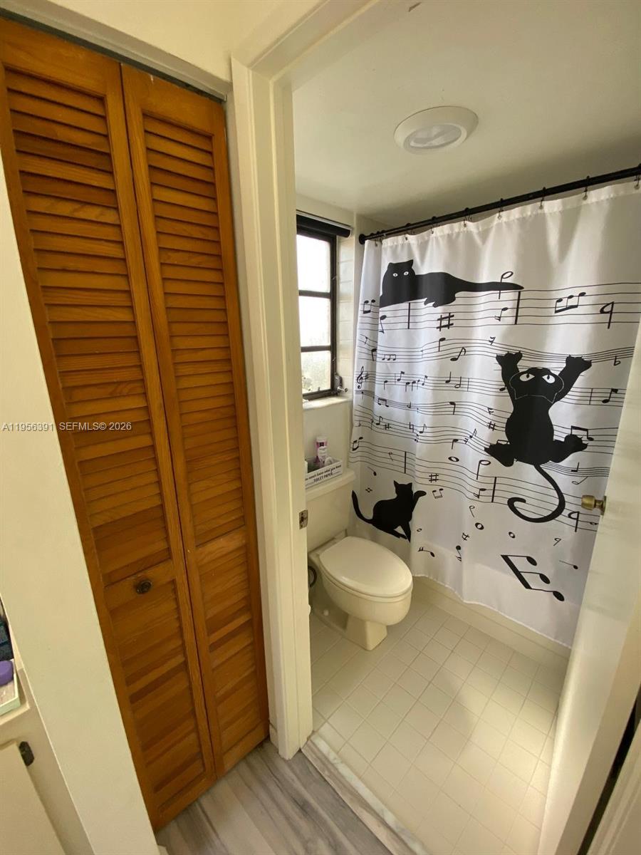 9070 Southwest 125th Avenue, Unit A101 Miami, FL 33186 - Photo 28 of 28 a bathroom with a toilet and shower