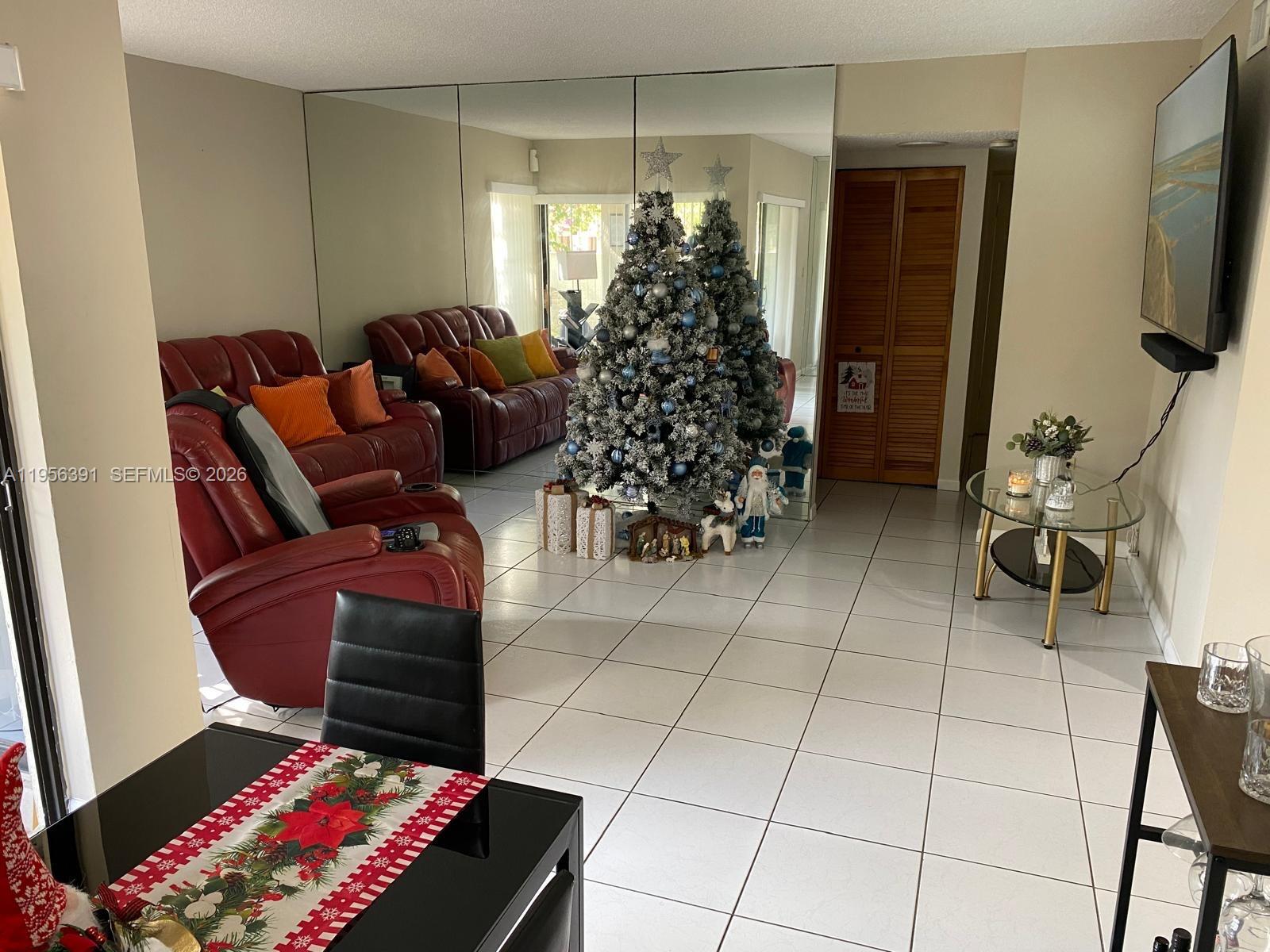 9070 Southwest 125th Avenue, Unit A101 Miami, FL 33186 - Photo 4 of 28 a living room with furniture