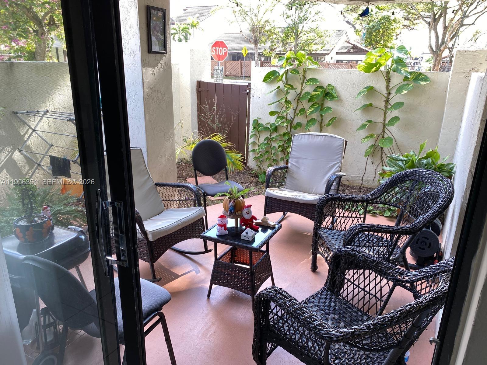 9070 Southwest 125th Avenue, Unit A101 Miami, FL 33186 - Photo 5 of 28 a view of a house with backyard and sitting area