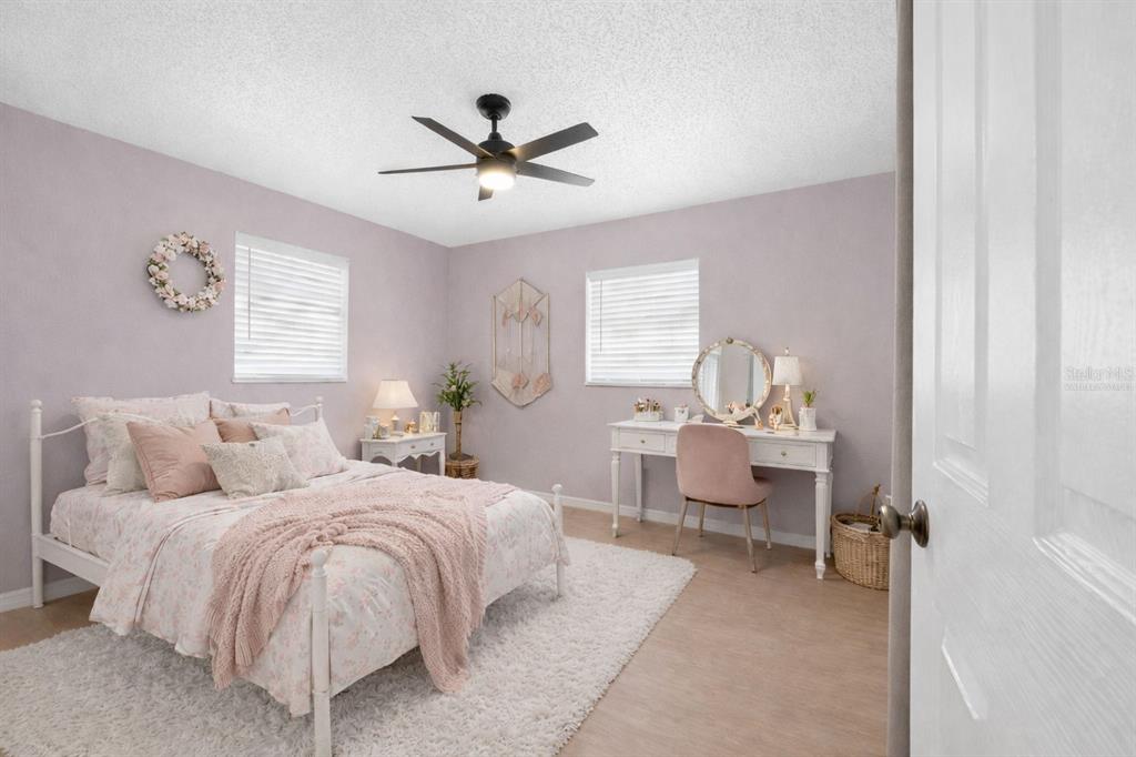 4489 Fishman Avenue Weeki Wachee, FL 34607 - Photo 11 of 29 a living room with a bed furniture and a window