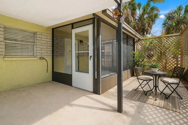a kitchen with stainless steel appliances kitchen island granite countertop a refrigerator and a sink