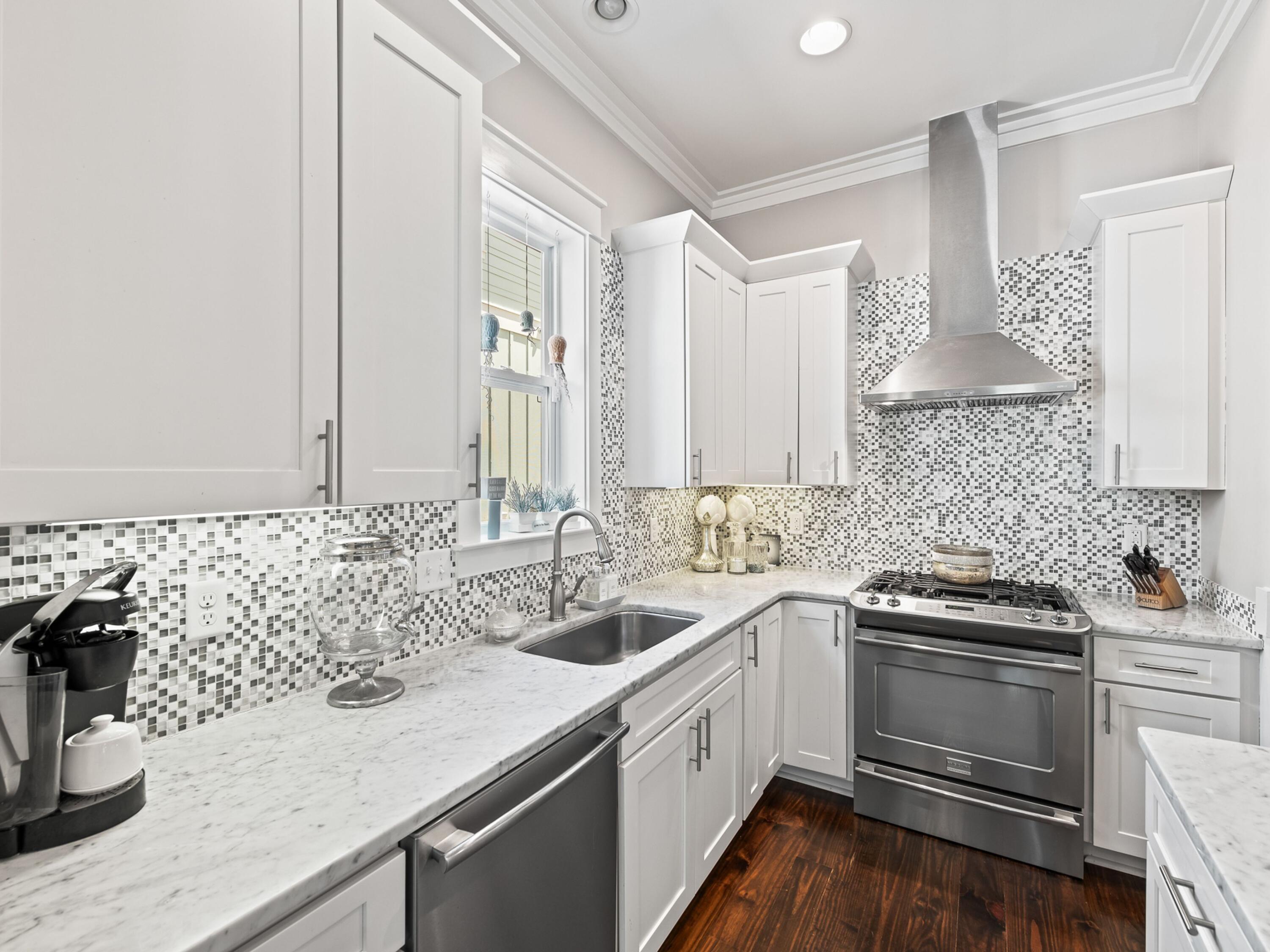 37 Dune Ridge Road Santa Rosa Beach, FL 32459 - Photo 13 of 40 a kitchen with a sink and cabinets