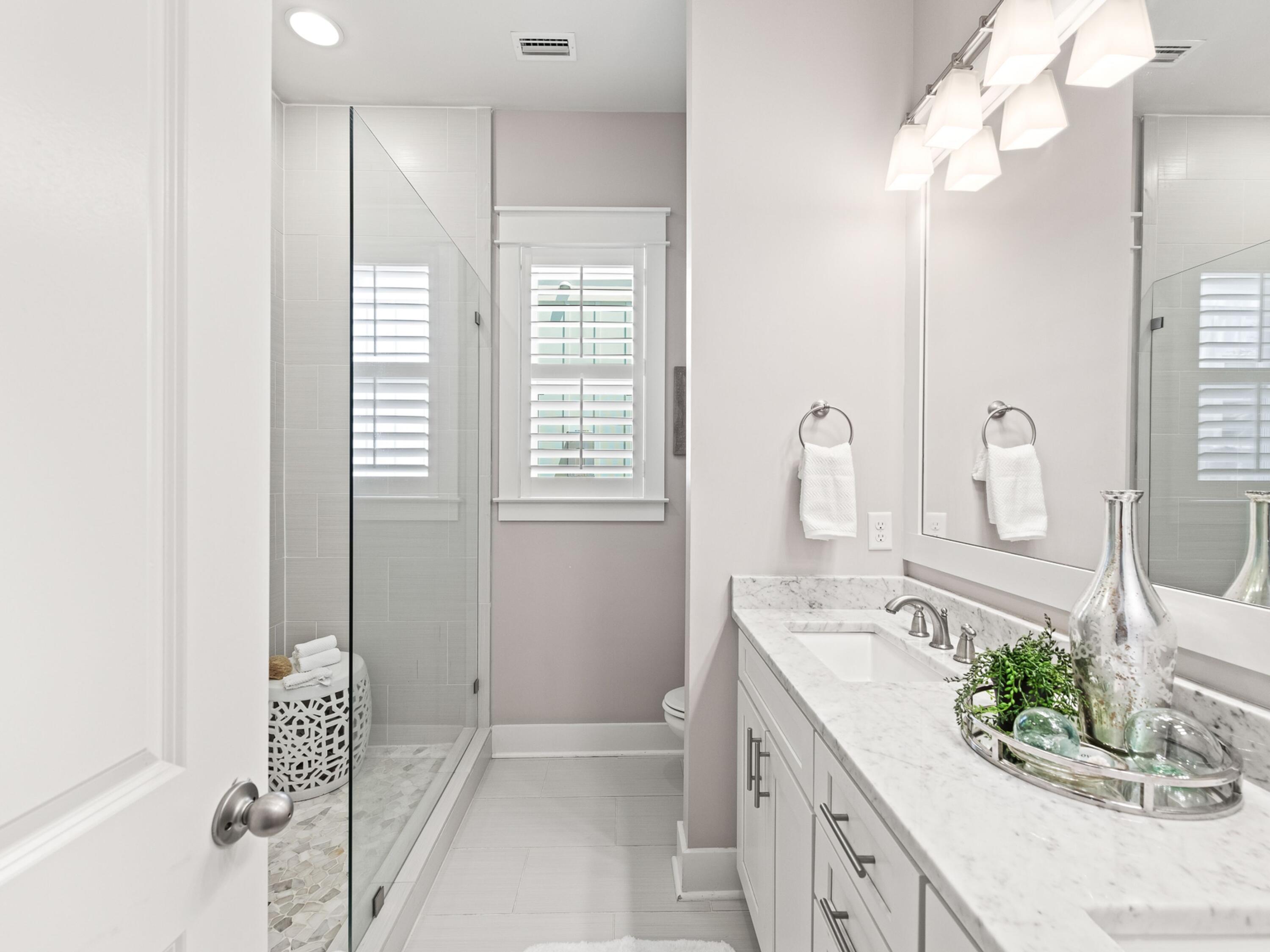 37 Dune Ridge Road Santa Rosa Beach, FL 32459 - Photo 17 of 40 a spacious bathroom with sinks mirror and vanity