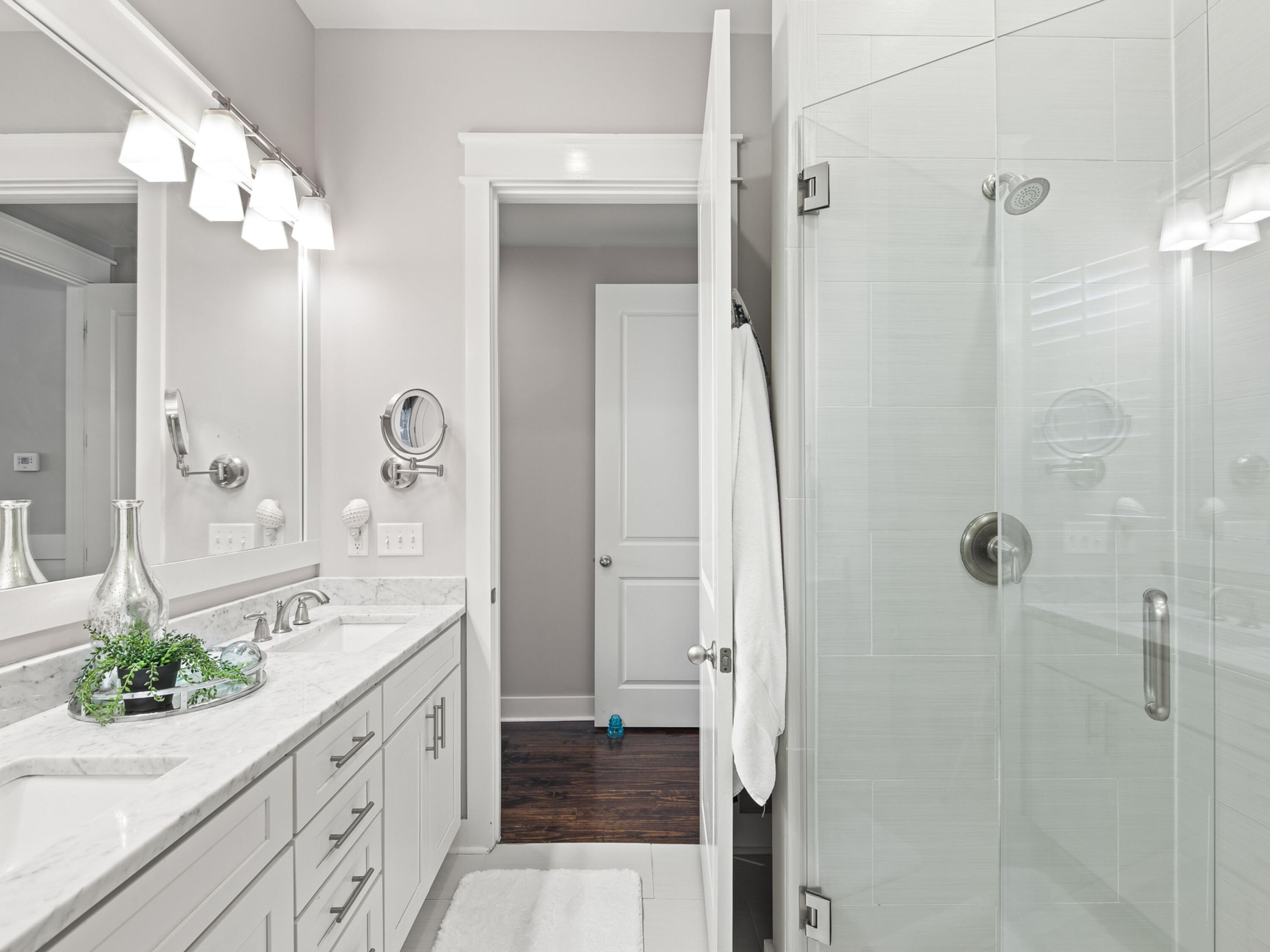 37 Dune Ridge Road Santa Rosa Beach, FL 32459 - Photo 18 of 40 a spacious bathroom with a double vanity sink and a mirror
