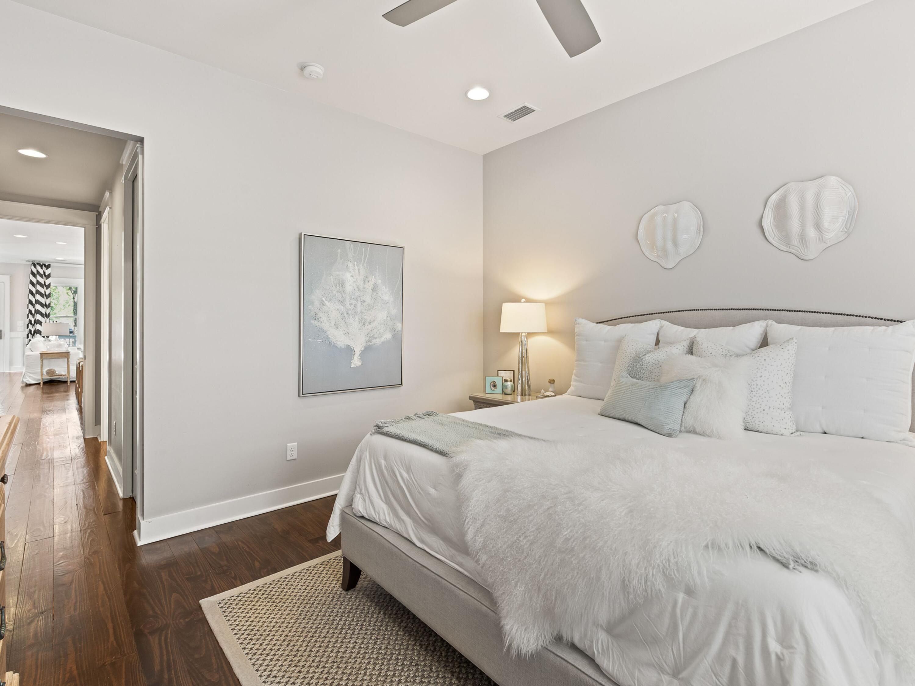 37 Dune Ridge Road Santa Rosa Beach, FL 32459 - Photo 20 of 40 a bedroom with a bed and wooden floor