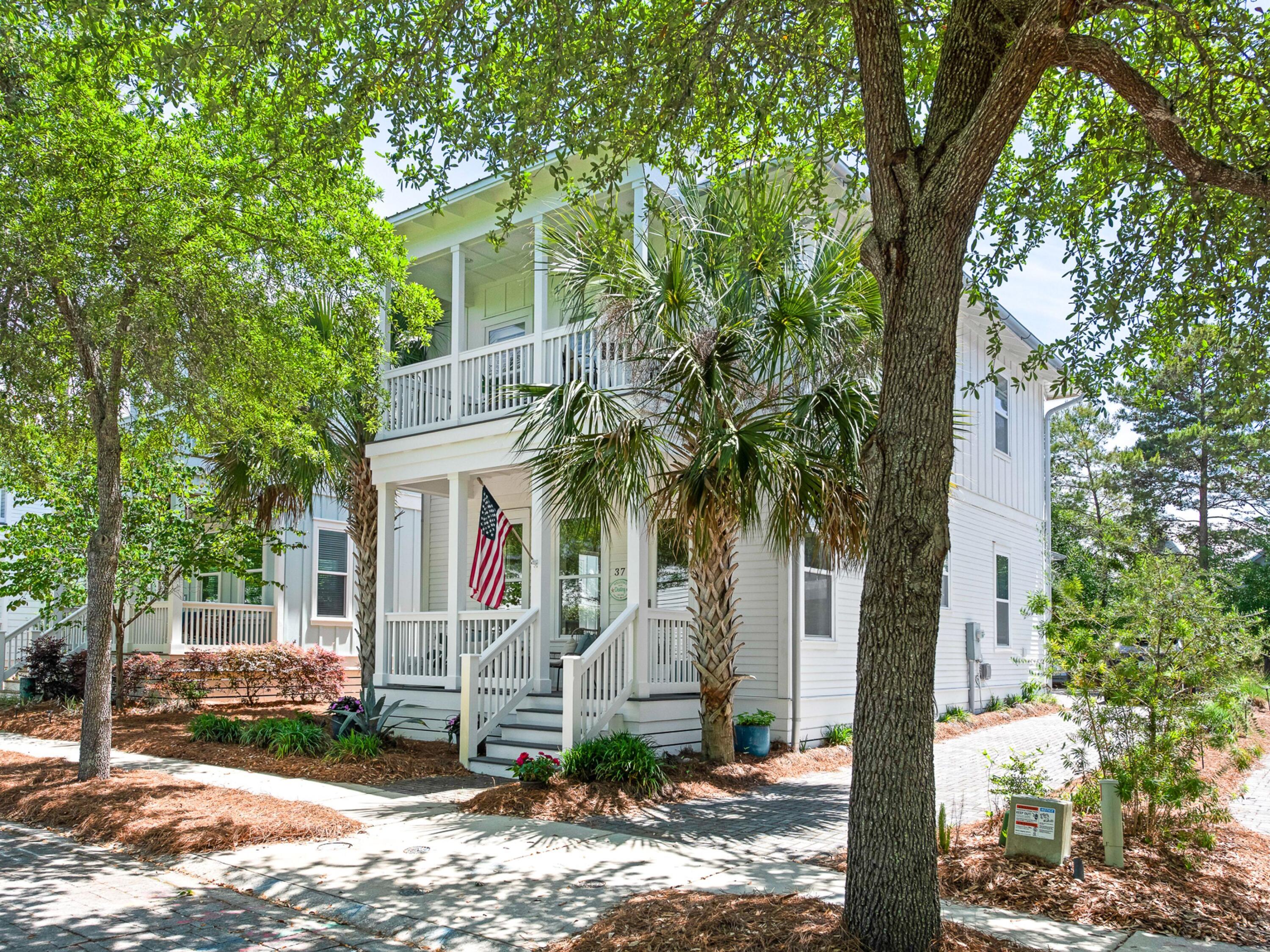 37 Dune Ridge Road Santa Rosa Beach, FL 32459 - Photo 2 of 40 a front view of a house with garden