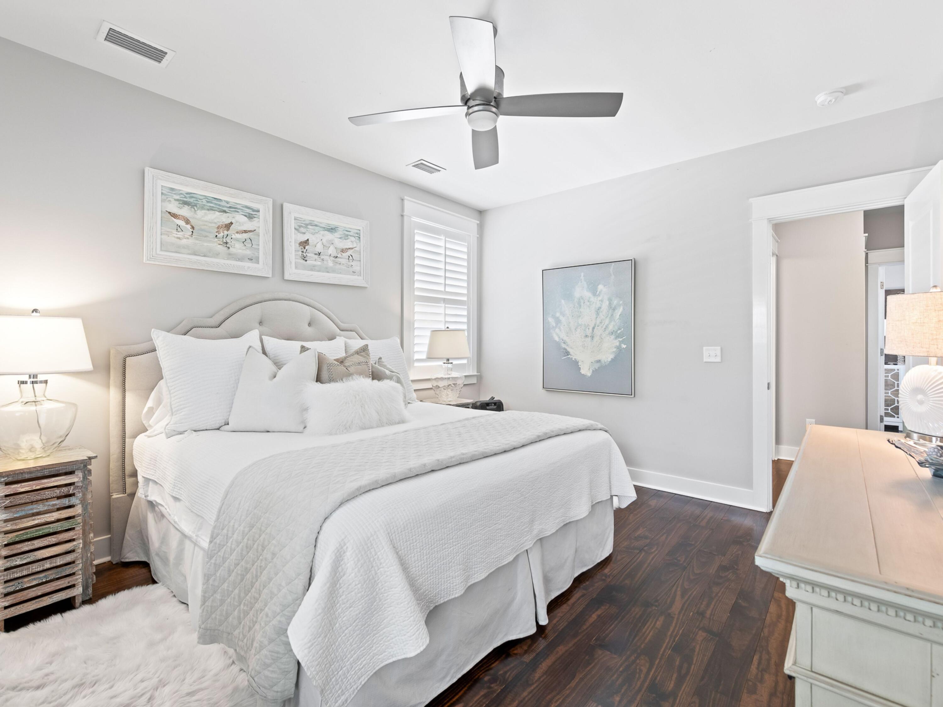 37 Dune Ridge Road Santa Rosa Beach, FL 32459 - Photo 23 of 40 a bedroom with bed and wooden floor