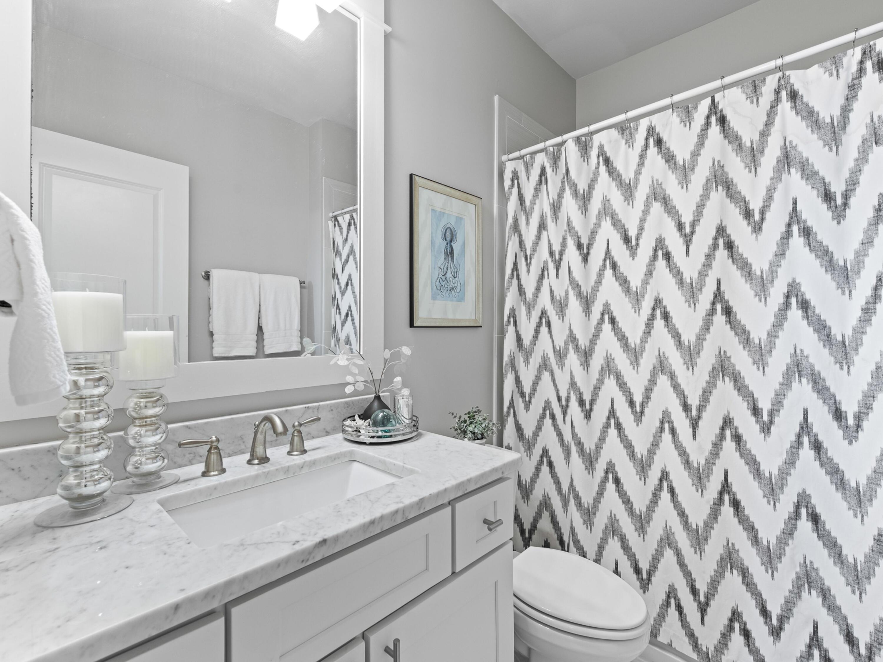 37 Dune Ridge Road Santa Rosa Beach, FL 32459 - Photo 28 of 40 a bathroom with a granite countertop sink a toilet and a mirror