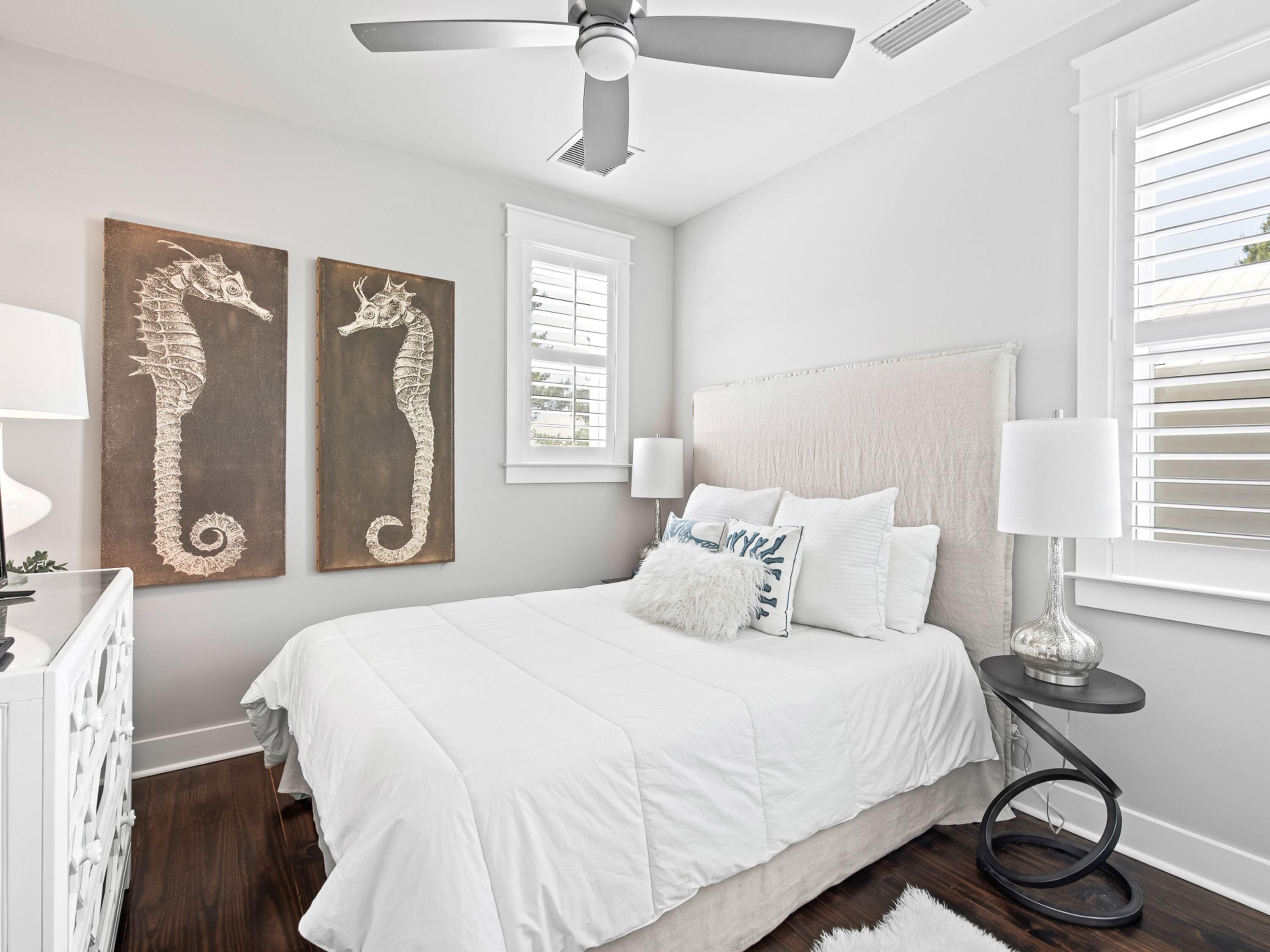 37 Dune Ridge Road Santa Rosa Beach, FL 32459 - Photo 29 of 40 a bedroom with a bed and wooden floor