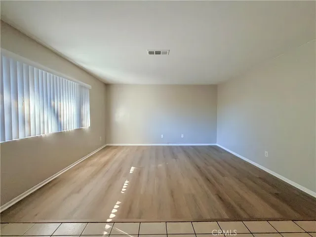 a view of an empty room and window