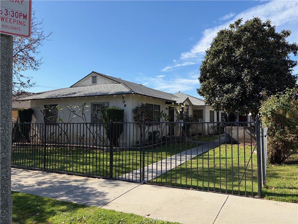 509 North Alameda Avenue Azusa, CA 91702 - Photo 7 of 11 a view of a wrought iron fences in front of house