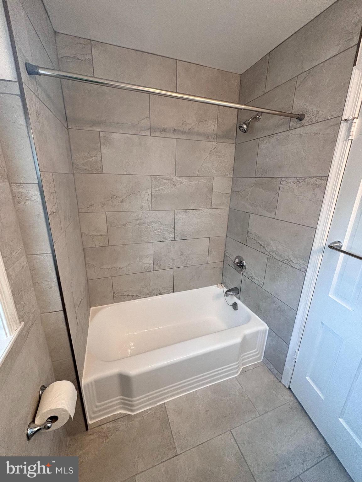 3810 V Street Southeast, Unit 301 Washington, DC 20020 - Photo 12 of 36 a bathroom with a bathtub and a shower