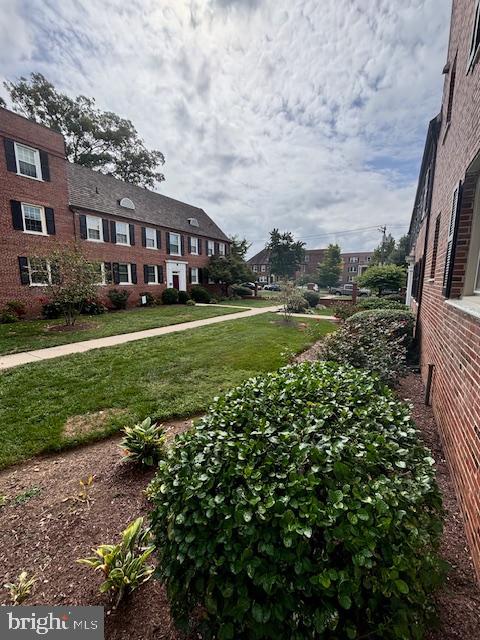 3810 V Street Southeast, Unit 301 Washington, DC 20020 - Photo 26 of 36 a view of a big house with a big yard and large trees