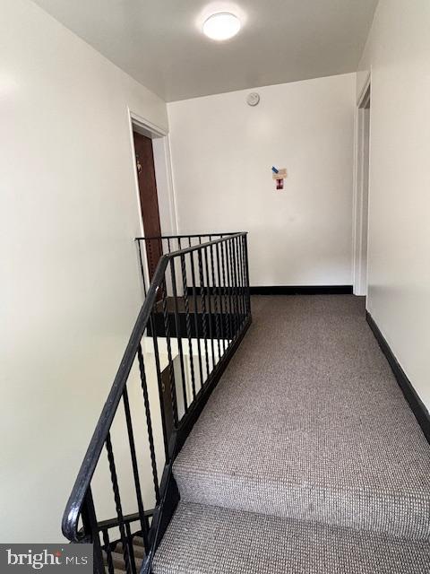 3810 V Street Southeast, Unit 301 Washington, DC 20020 - Photo 29 of 36 a view of staircase with railing and white walls