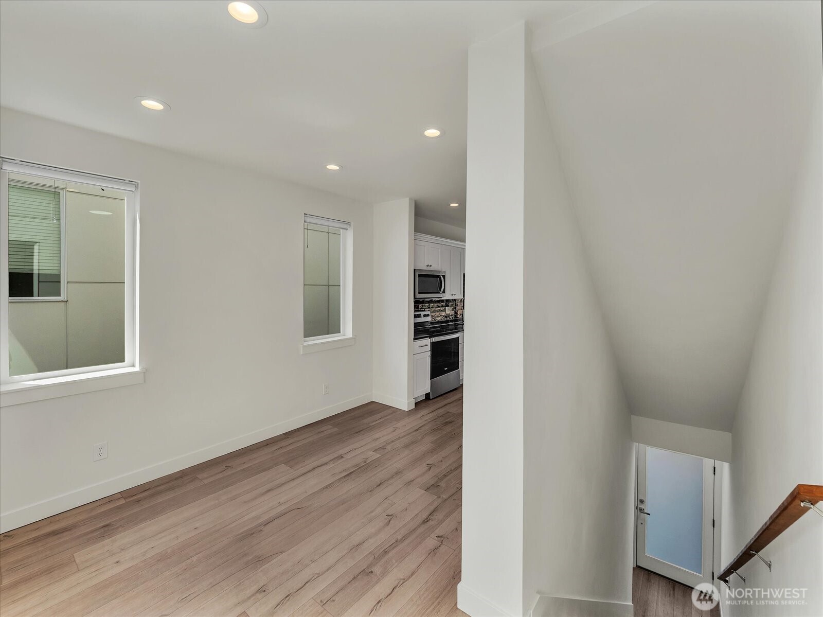 3628 14th Avenue South Seattle, WA 98144 - Photo 6 of 24 a view of an empty room with wooden floor and a window