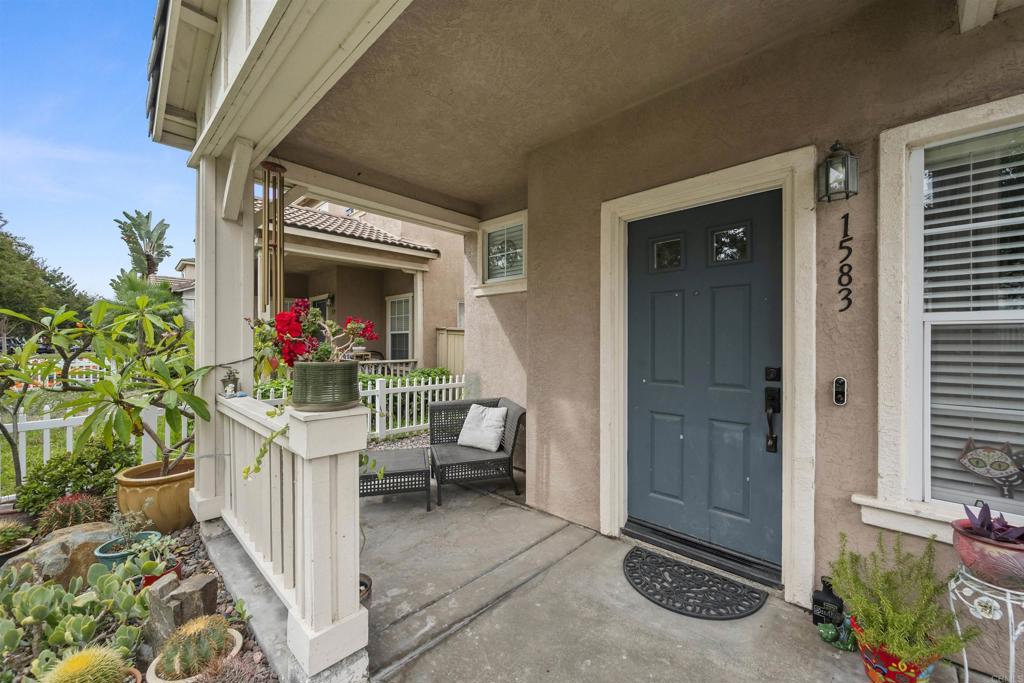 a view of outdoor dining space with a porch